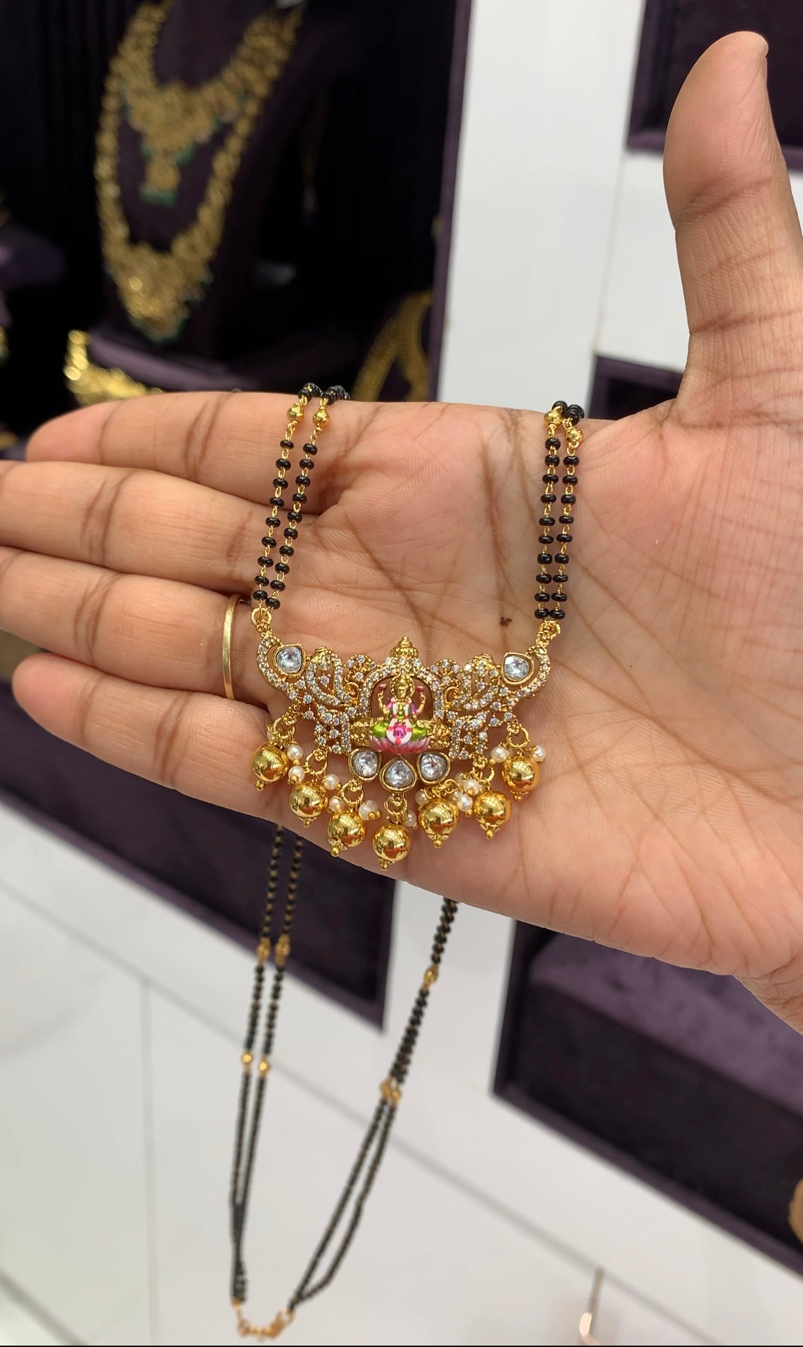 Beautiful CZ stones Lakshmi devi pendant with blackbeads chain 24 inchs long