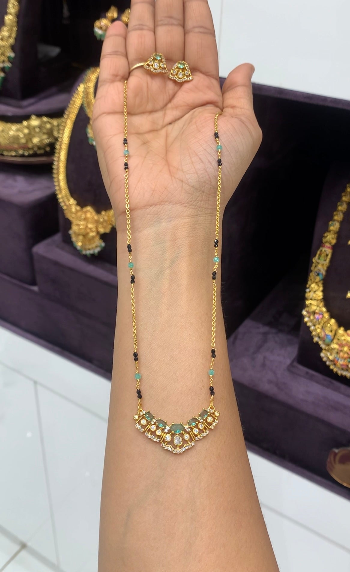 Beautiful green stone pendant set with handmaking blackbeads & chandraharam chain 18 inchs long