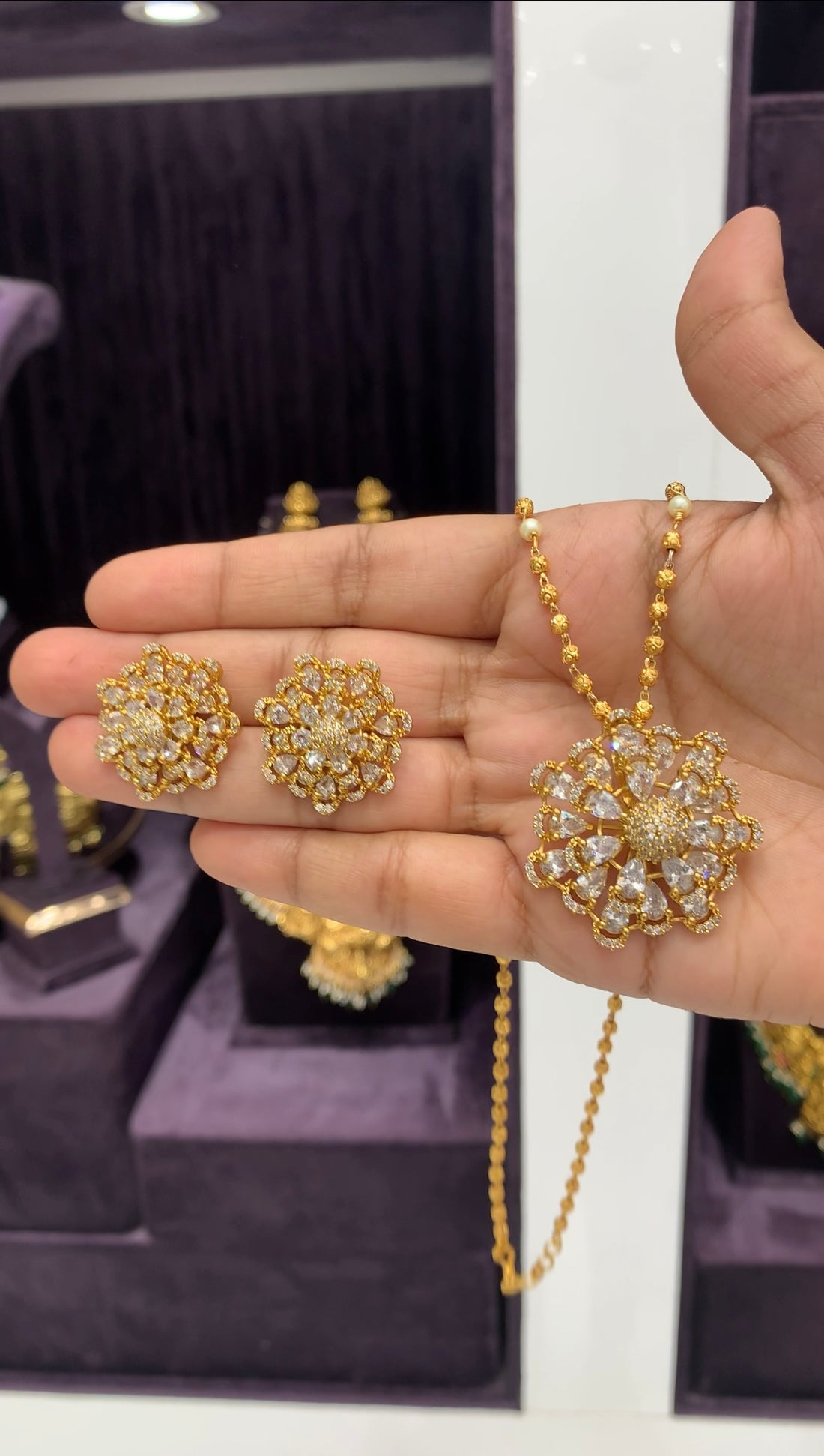 Because white stone pendant set with gold balls chain 18 inchs long