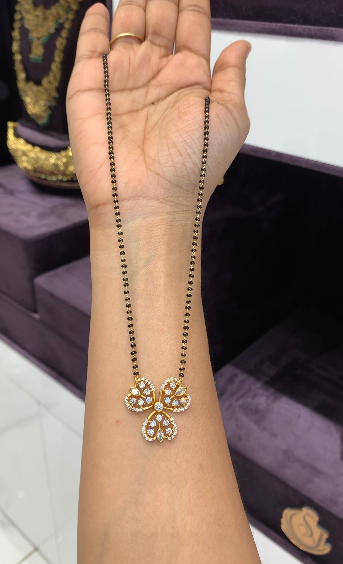 Beautiful white stone pendant with blackbeads chain 18 inchs long