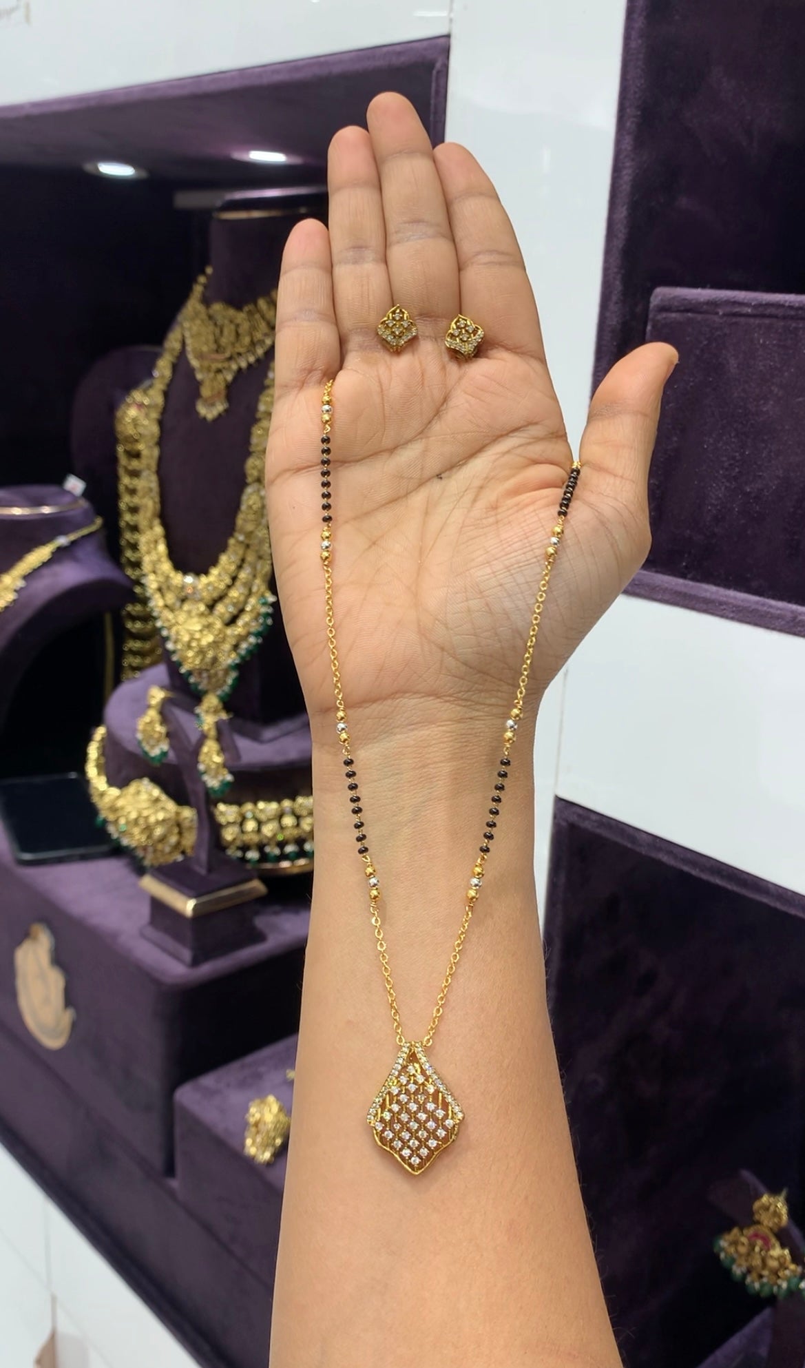 Beautiful white stone pendant set with blackbeads & chandraharam chain 18 inchs long