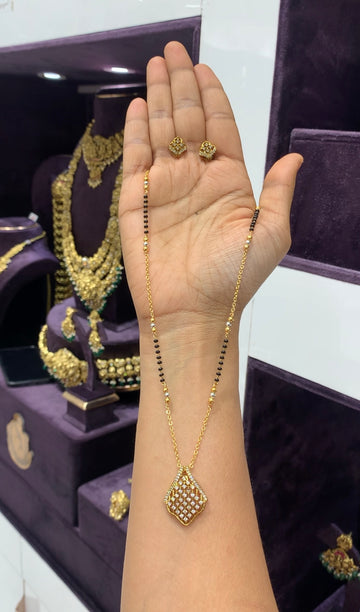 Beautiful white stone pendant set with blackbeads & chandraharam chain 18 inchs long