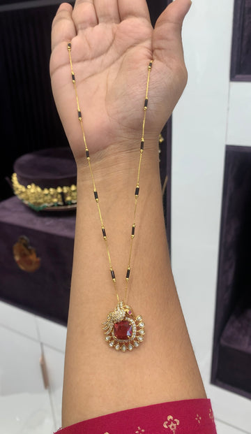 Beautiful red color stone pendant with black beads chain 18 inchs long