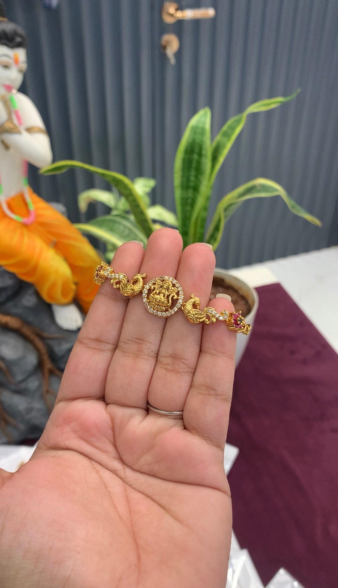 Beautiful Lakshmi devi & peacock design bracelet with adjustable chain.
