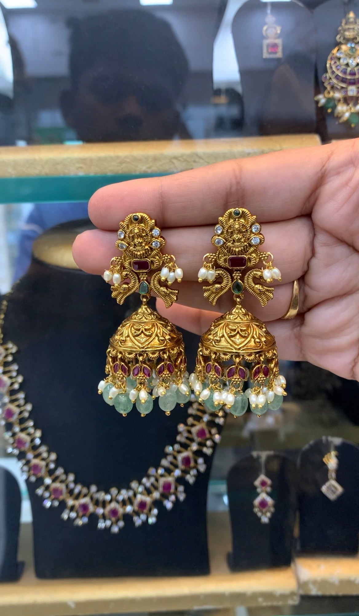 Beautiful Lakshmi devi pushback jumkis with aqua beads finishing