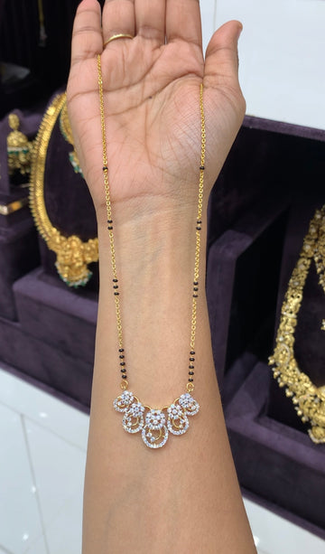 Beautiful white stone pendant with handmaking chandraharam & blackbeads chain 18 inchs long