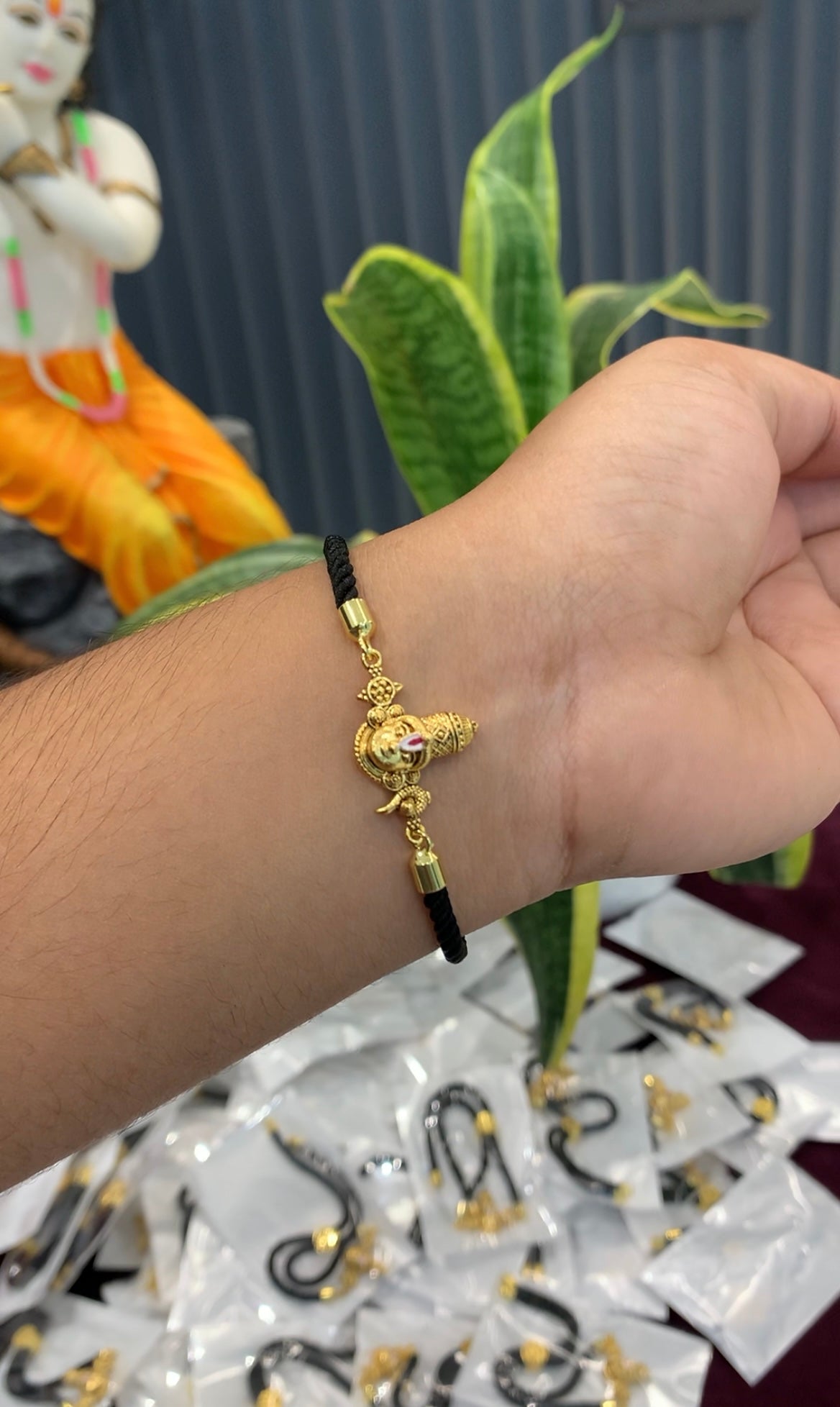 Beautiful balaji idol bracelet with black thread