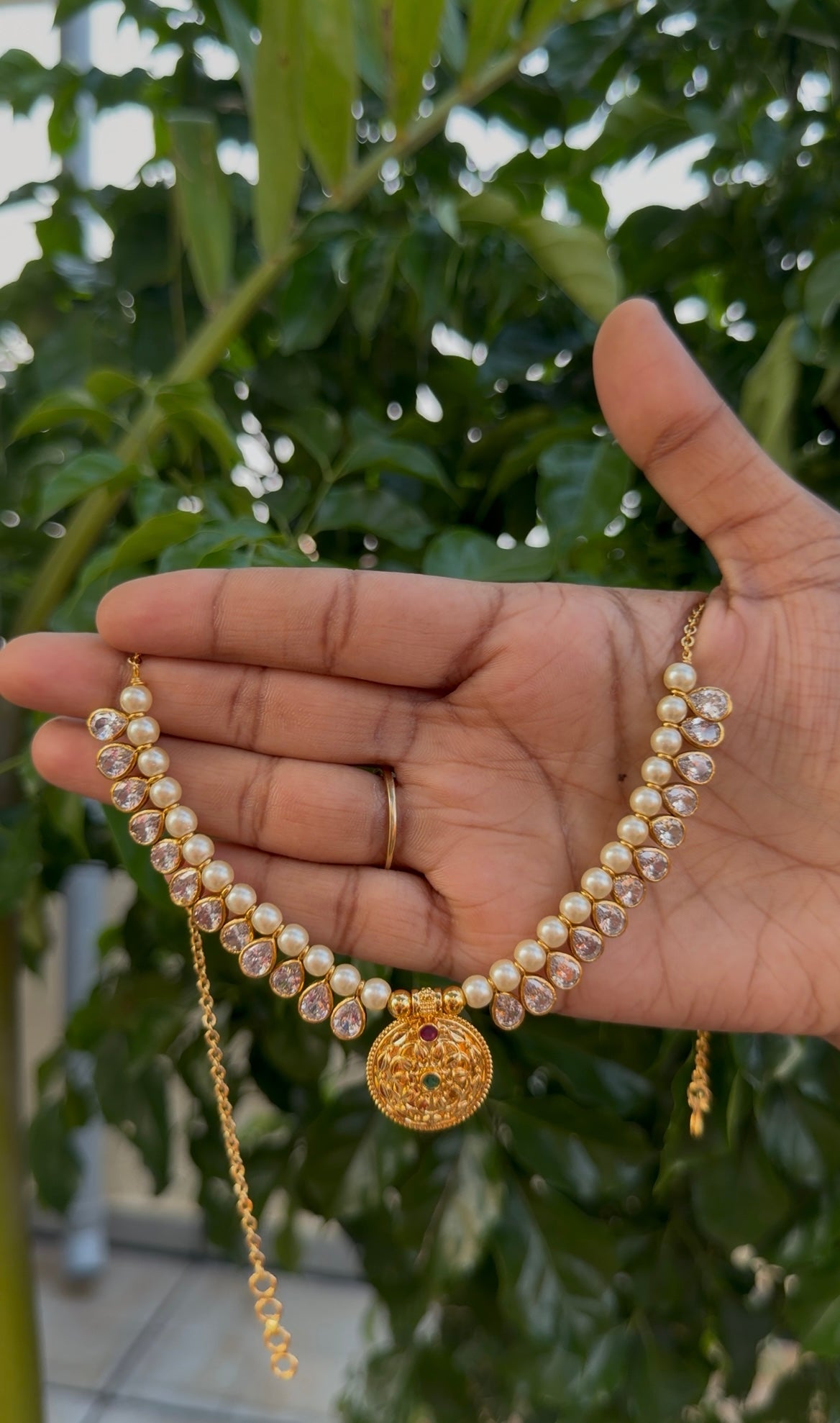 Beautiful white pearls with locket neckset