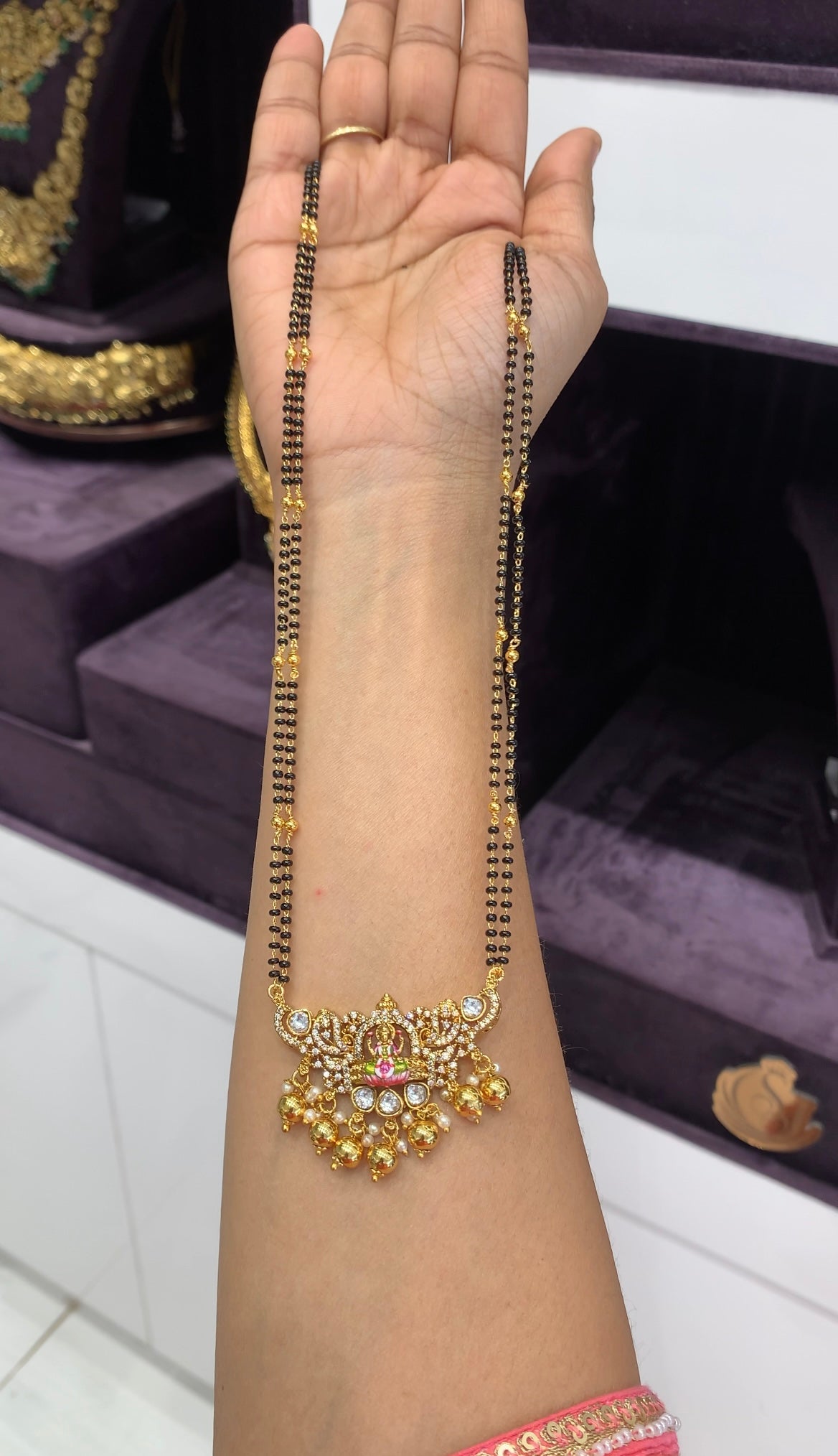 Beautiful CZ stones Lakshmi devi pendant with blackbeads chain 24 inchs long