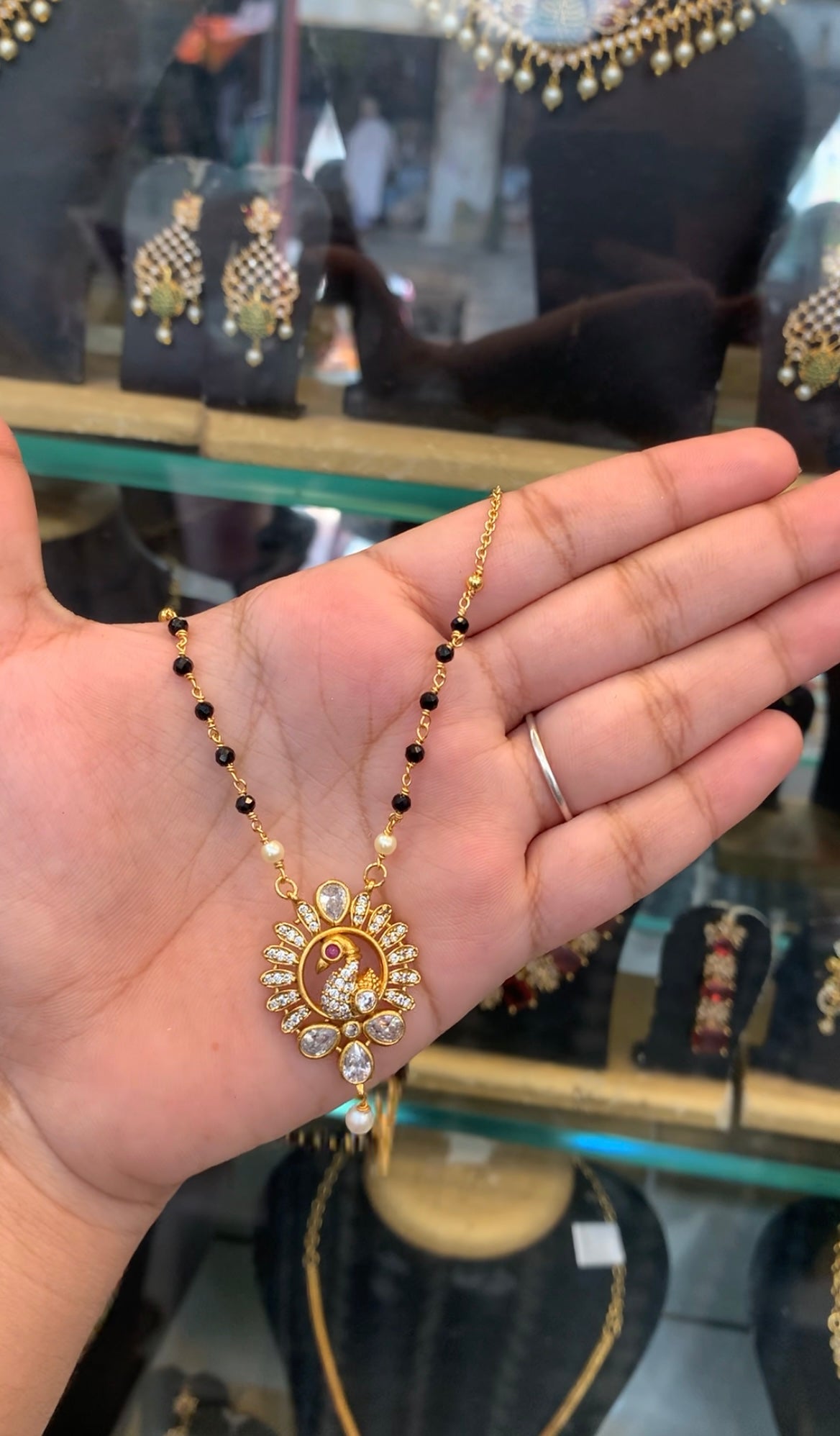 Beautiful peacock design pendant black beads & chandraharam chain 18 inchs long
