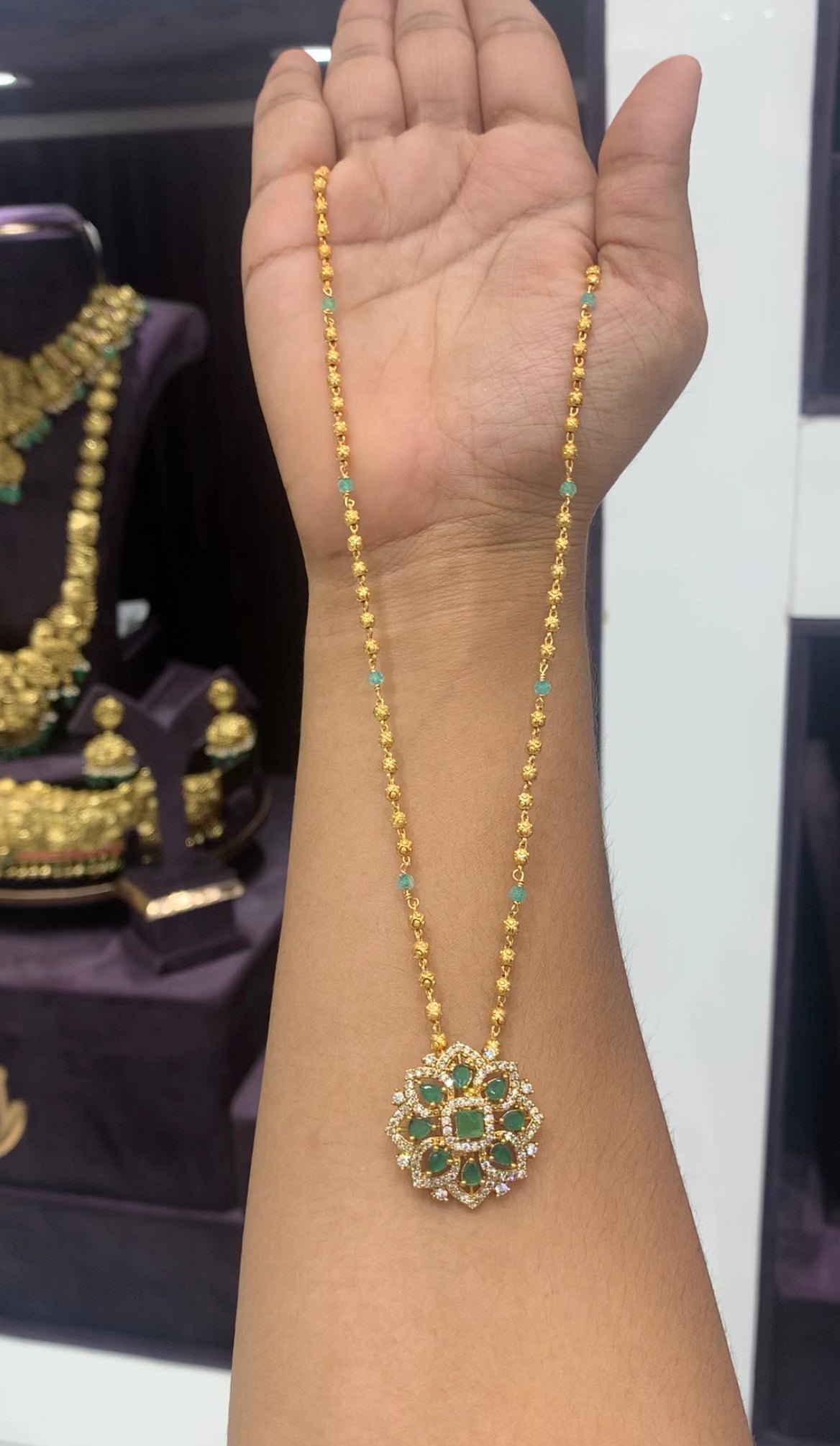 Beautiful green stone pendant with gold balls chain 18 inchs long