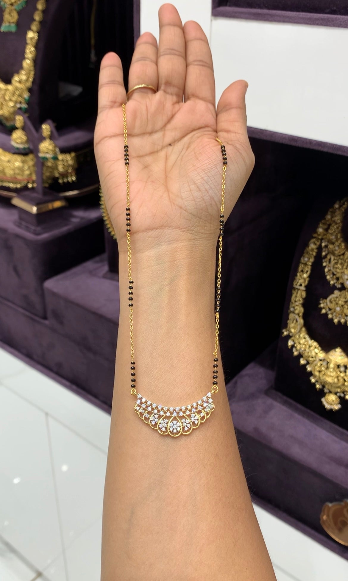 Beautiful White stones diamond replica pendent with chandraharam & blackbeads chain 18 inchs long