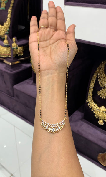 Beautiful White stones diamond replica pendent with chandraharam & blackbeads chain 18 inchs long