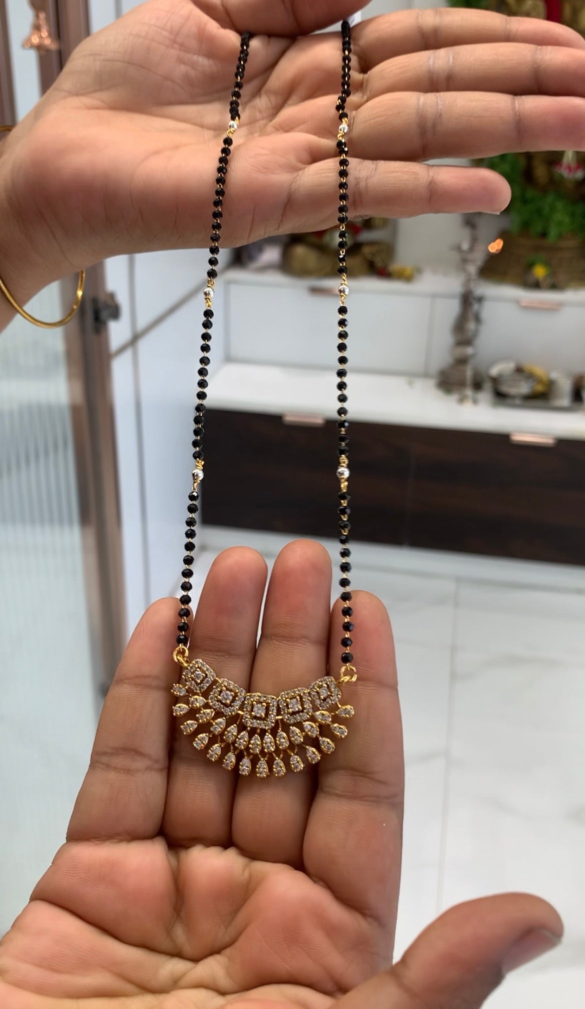 Beautiful white stones locket with blackbeads chain 18 inchs long