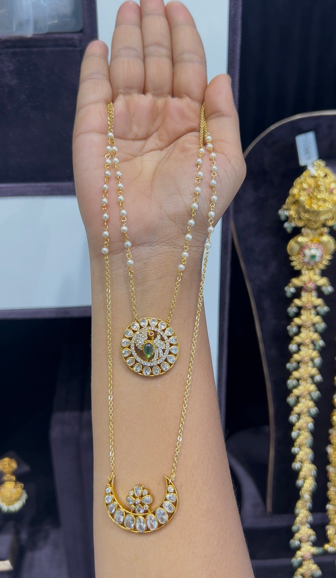 Beautiful sun & moon locket with white pearls & chandraharam chain 20 to 24 inchs long