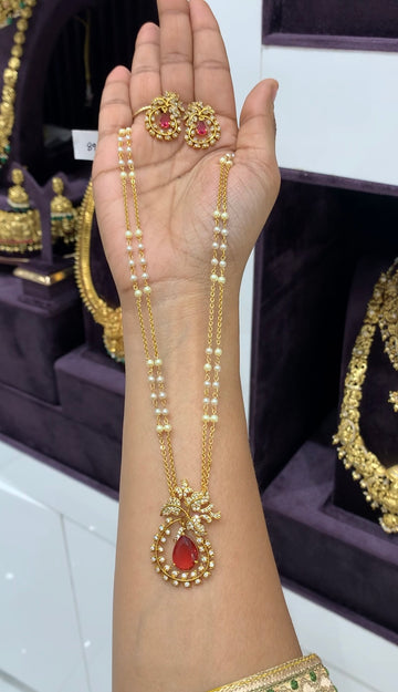 Beautiful ruby color pendant set with handmaking chandraharam & pearls chain 18 inchs long