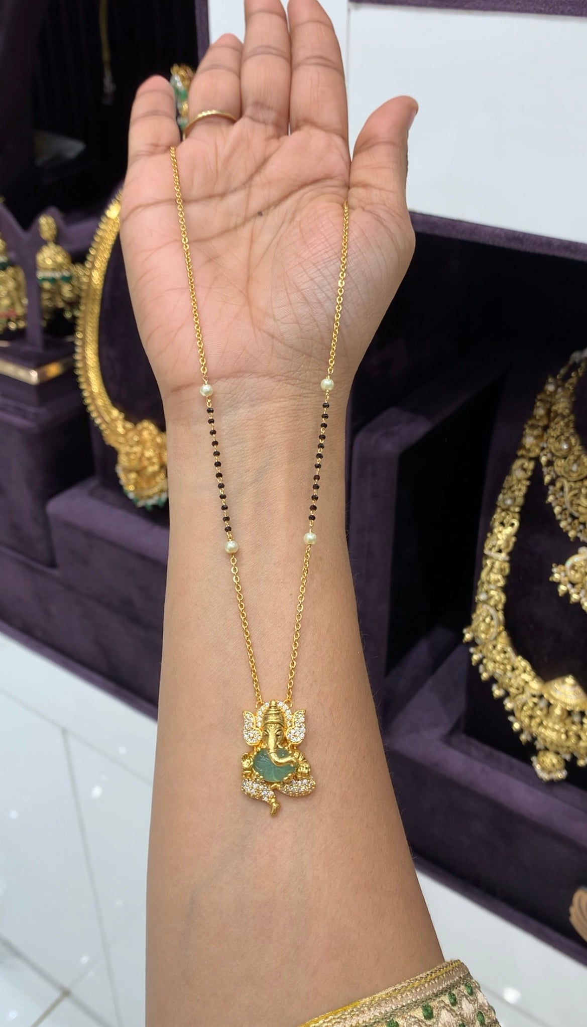 Beautiful ganesh pendent with handmaking chandraharam & blackbeads chain 18 inchs long