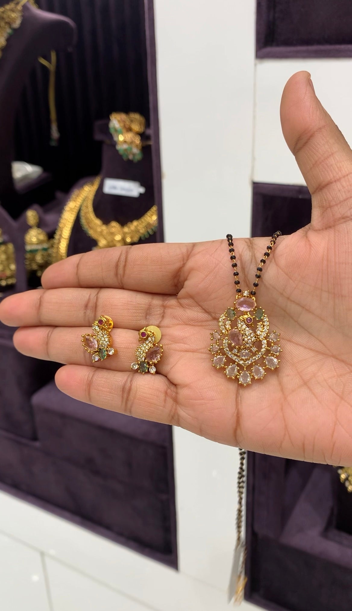 Beautiful peacock design CZ stones pendent set with blackbeads chain 18 inchs long