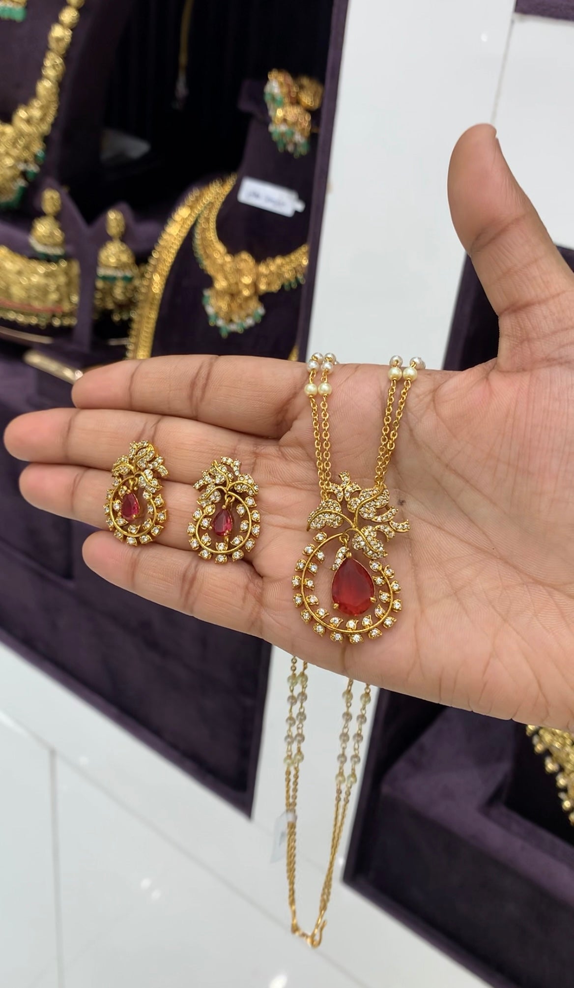 Beautiful ruby color pendant set with handmaking chandraharam & pearls chain 18 inchs long