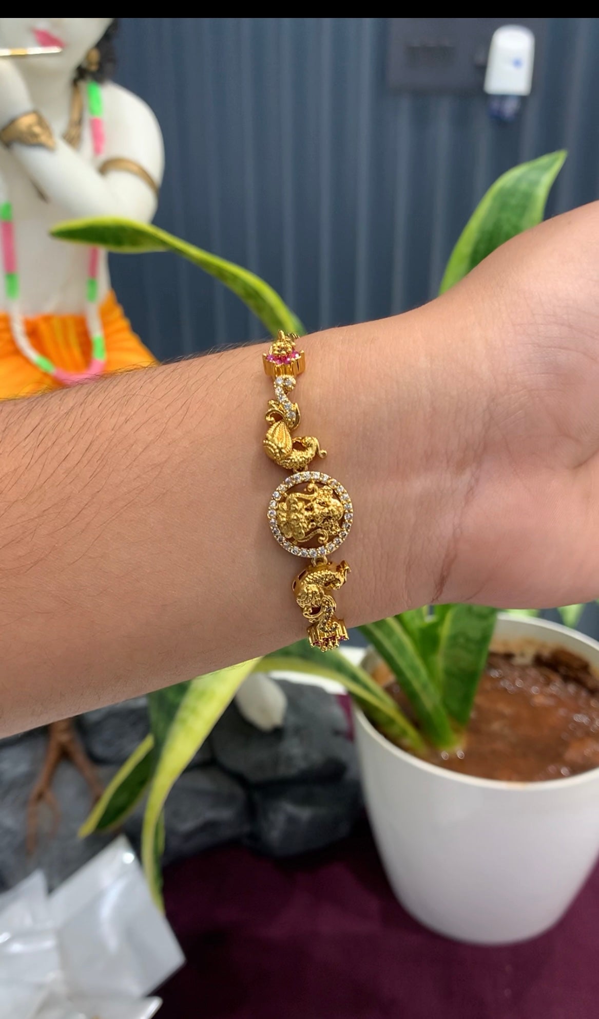 Beautiful Lakshmi devi & peacock design bracelet with adjustable chain.