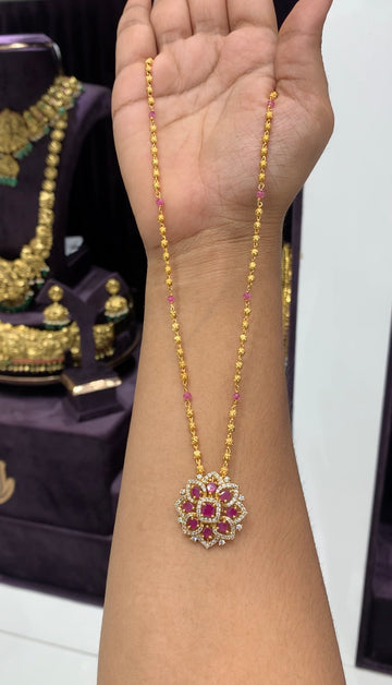 Beautiful ruby stone pendant with gold balls chain 18 inchs long