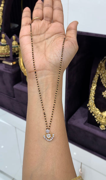 Beautiful white stone pendent with blackbeads chain 18 inch long