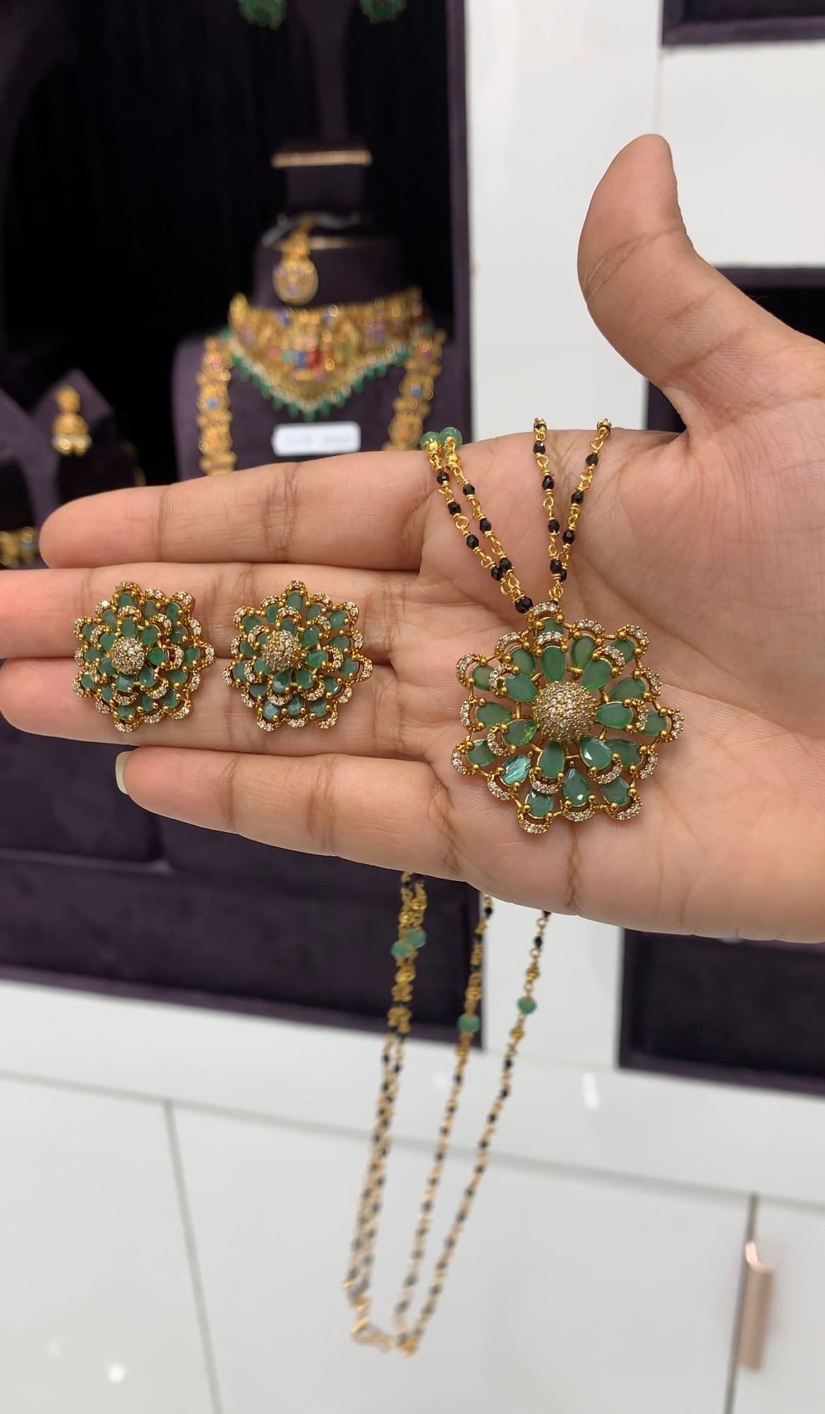 Beautiful green stone pendant set with blackbeads chain 18 inchs long