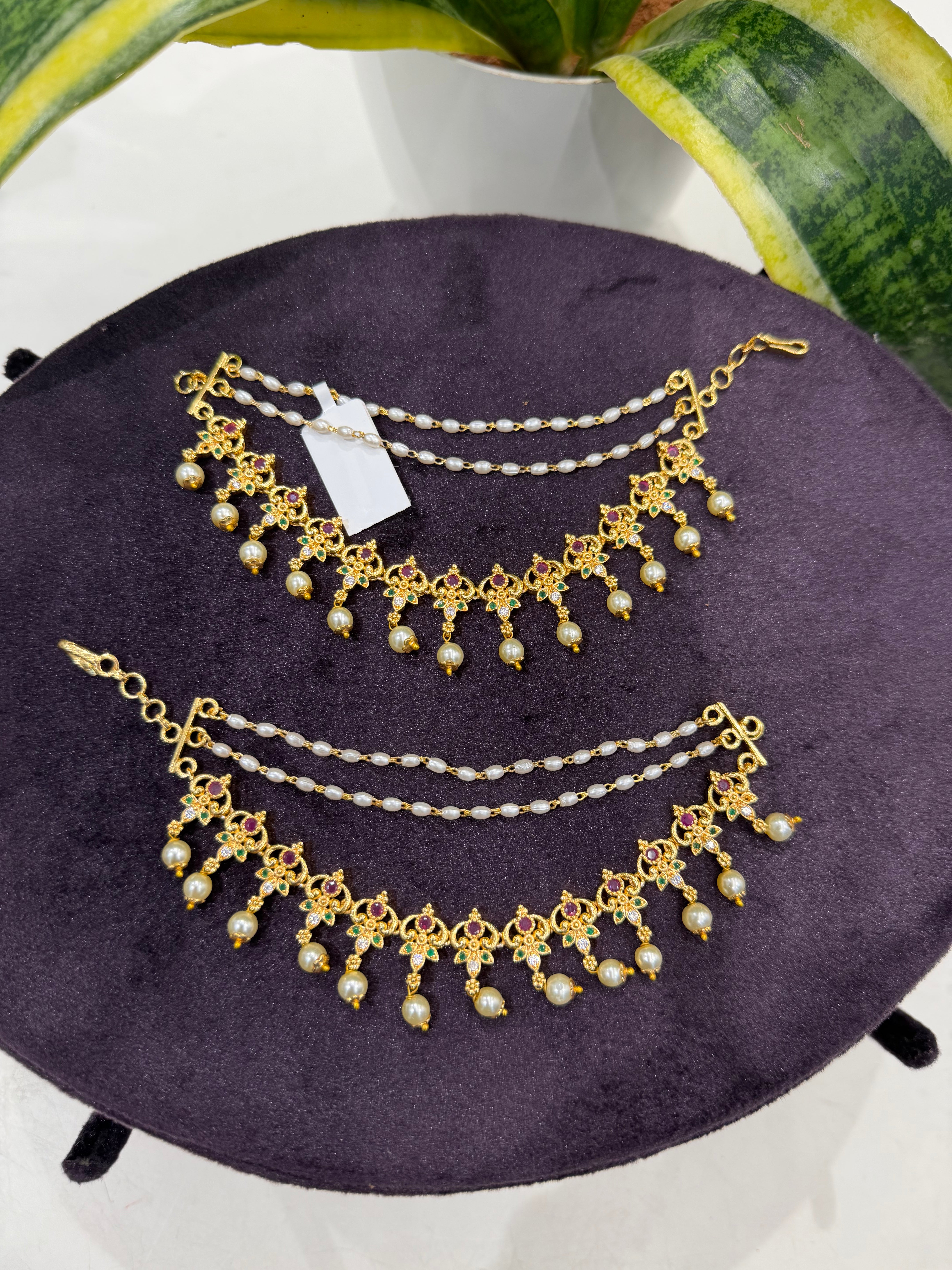 Beautiful multi stone champaswaralu with pearls finishing