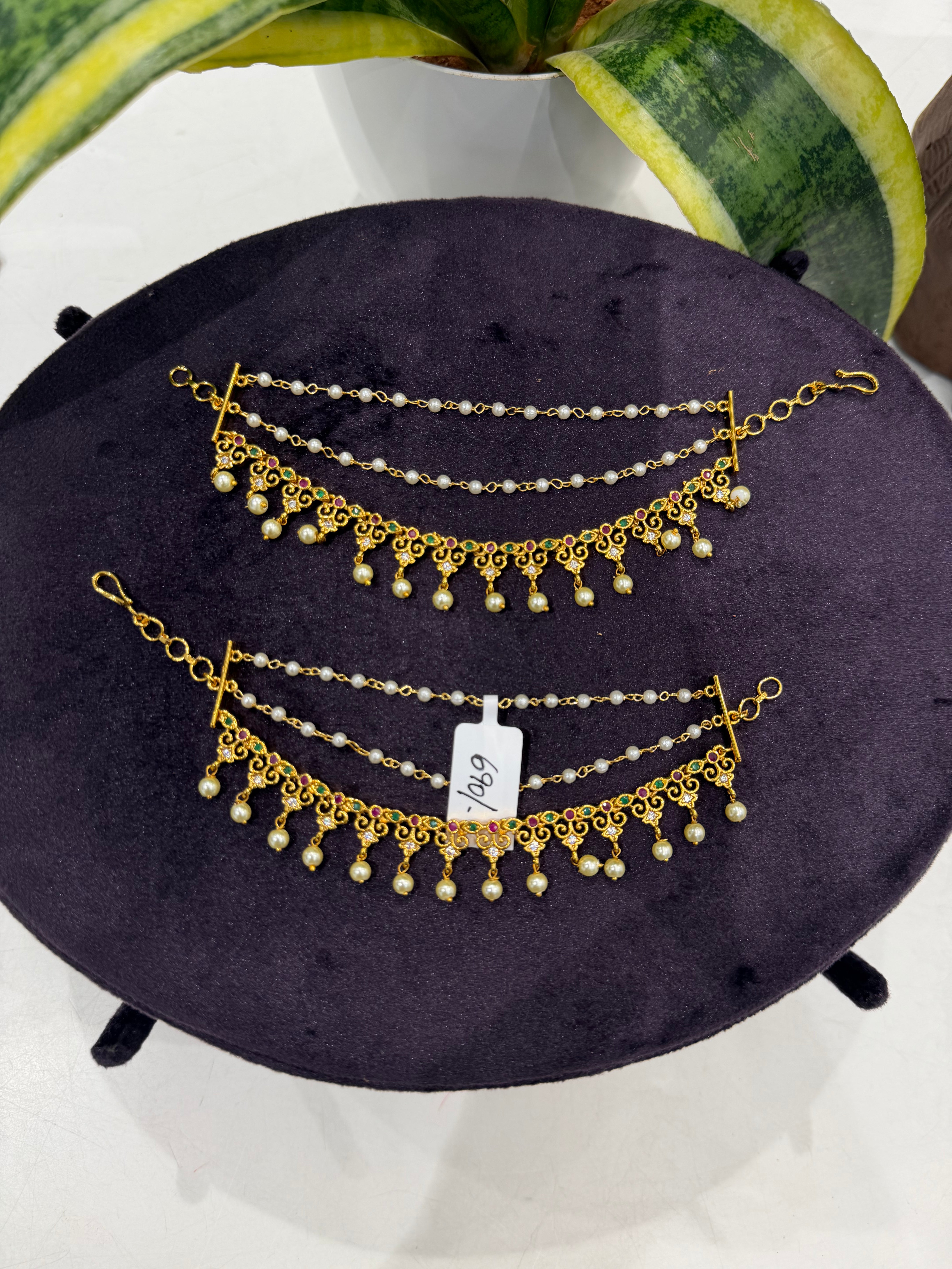 Beautiful multi stone champaswaralu with pearls finishing