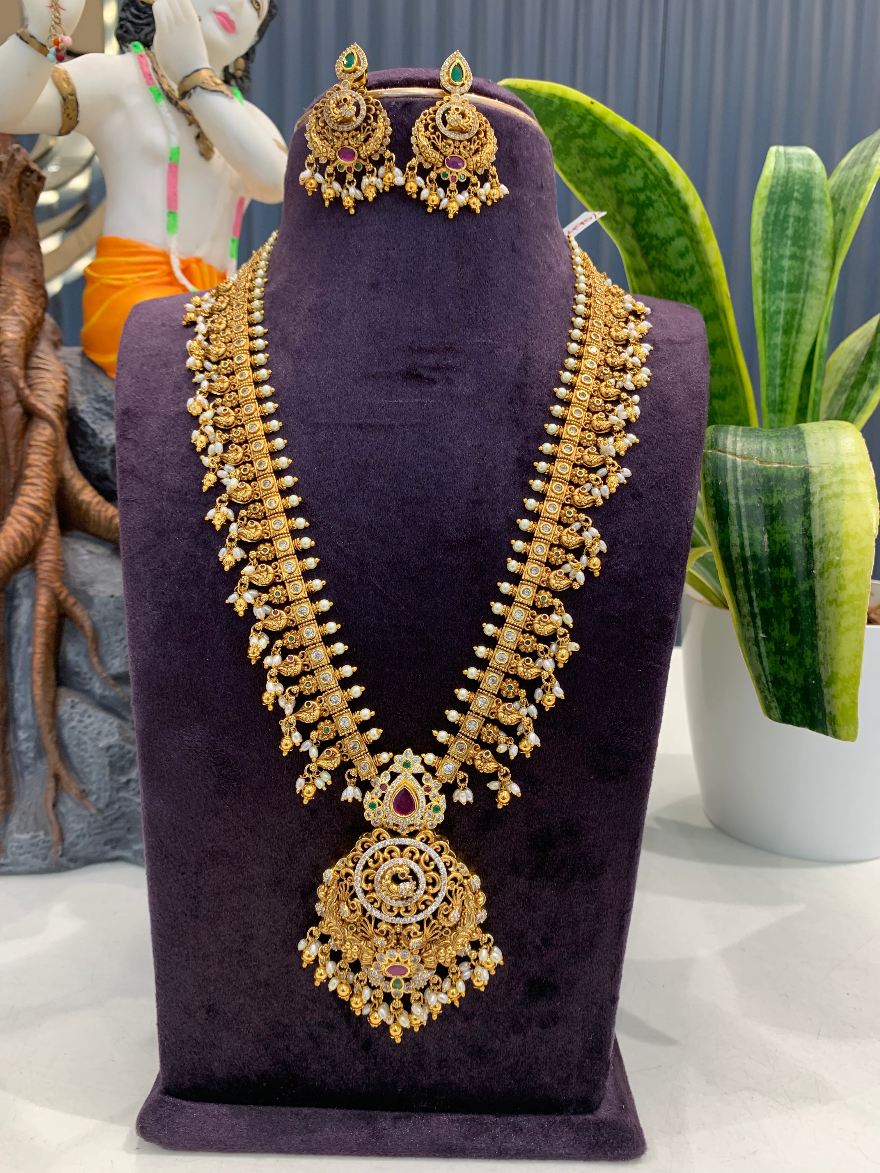Beautiful peacock design & CZ stones long haram with screwback ear hangings