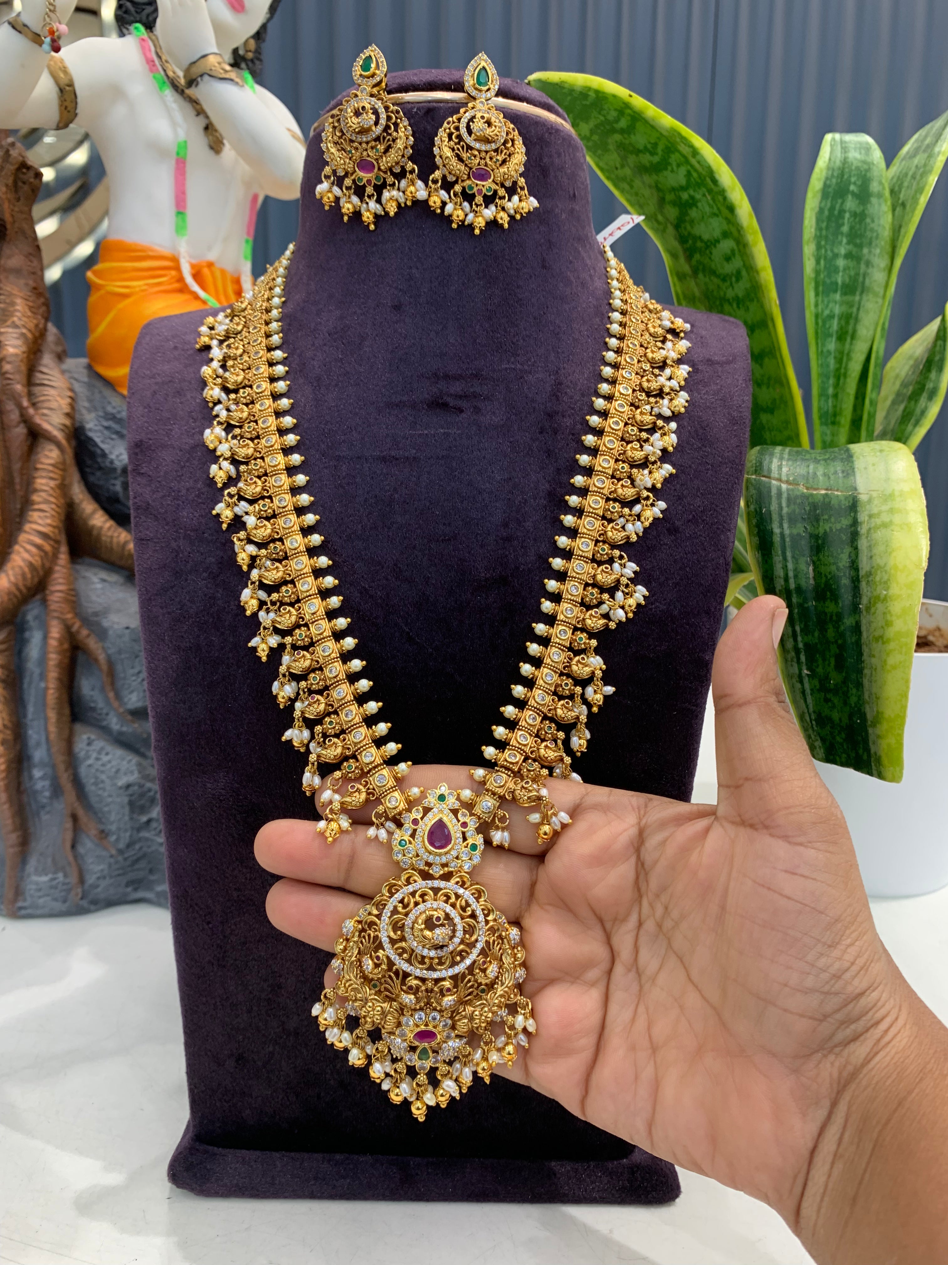 Beautiful peacock design & CZ stones long haram with screwback ear hangings