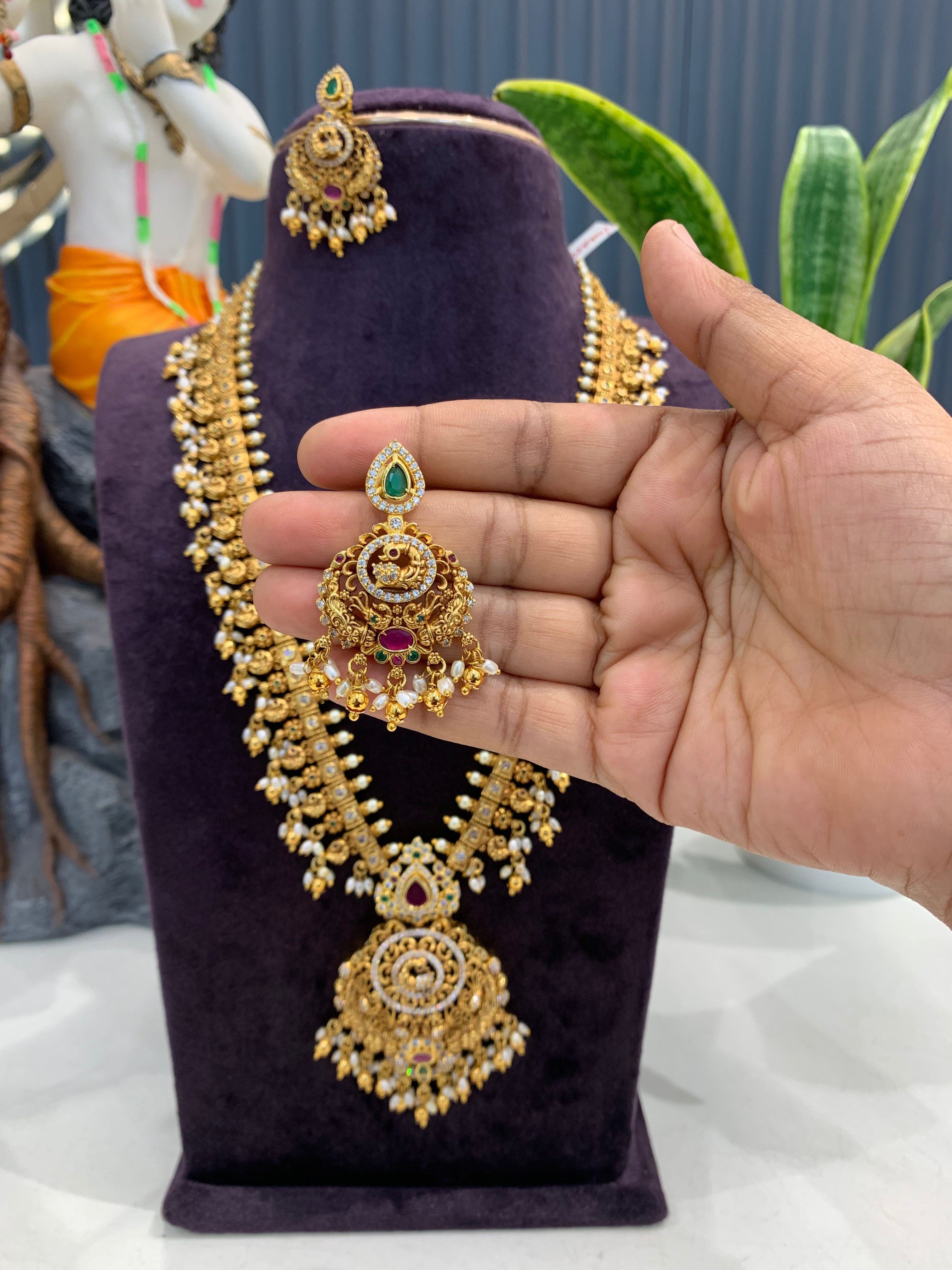 Beautiful peacock design & CZ stones long haram with screwback ear hangings