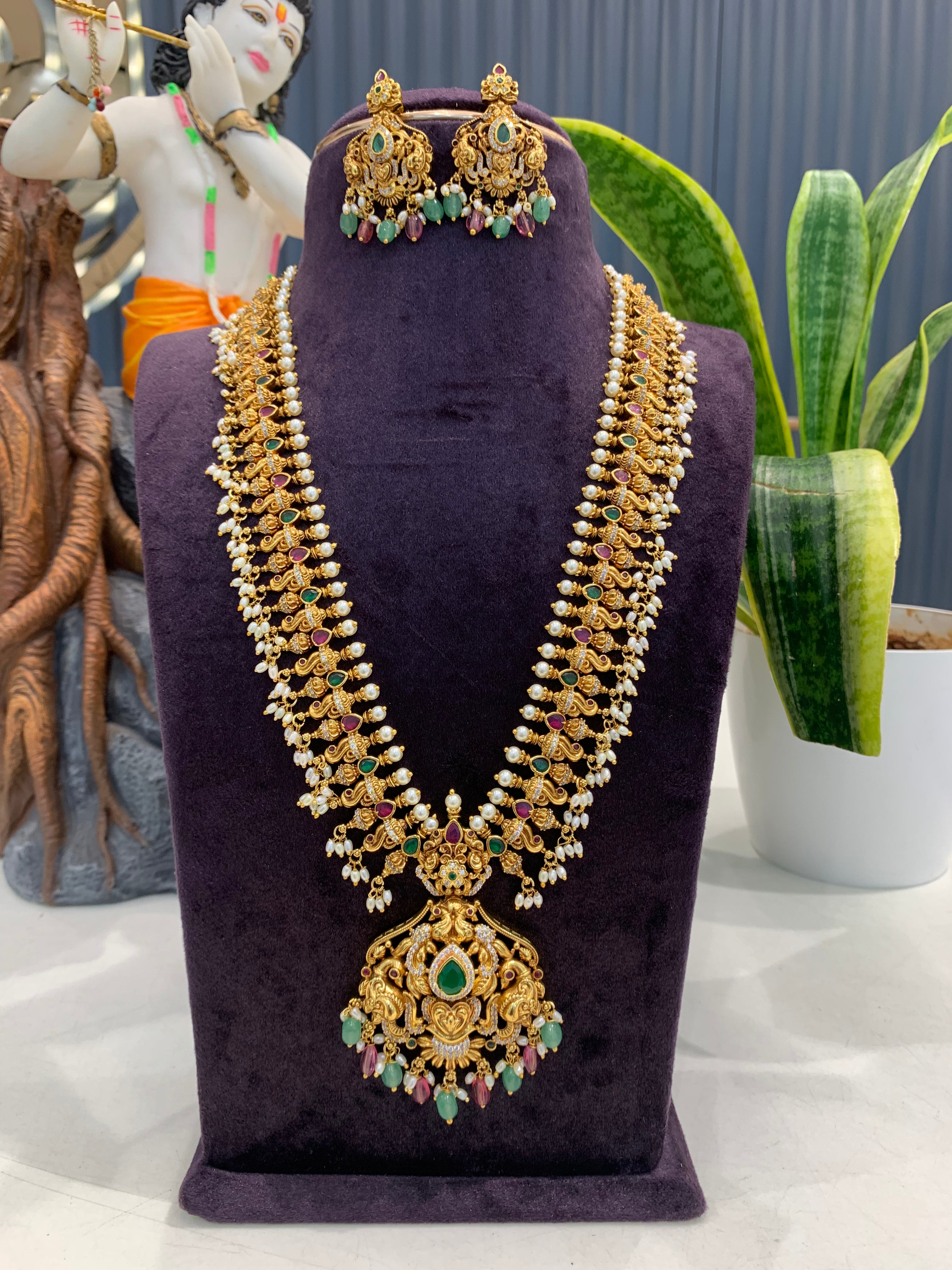 Beautiful multi color peacock design beads finishing long haram with screwback ear hangings