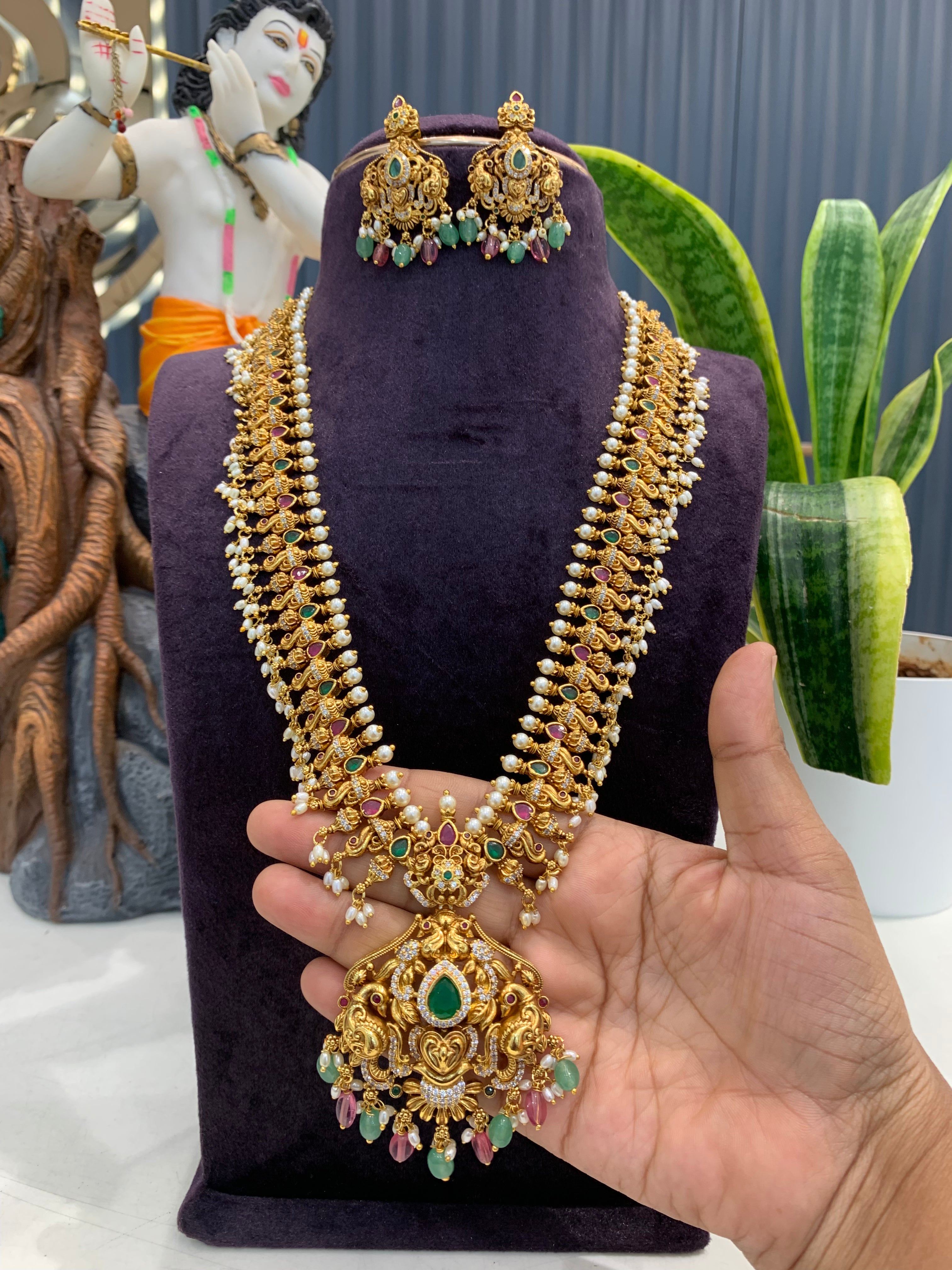 Beautiful multi color peacock design beads finishing long haram with screwback ear hangings