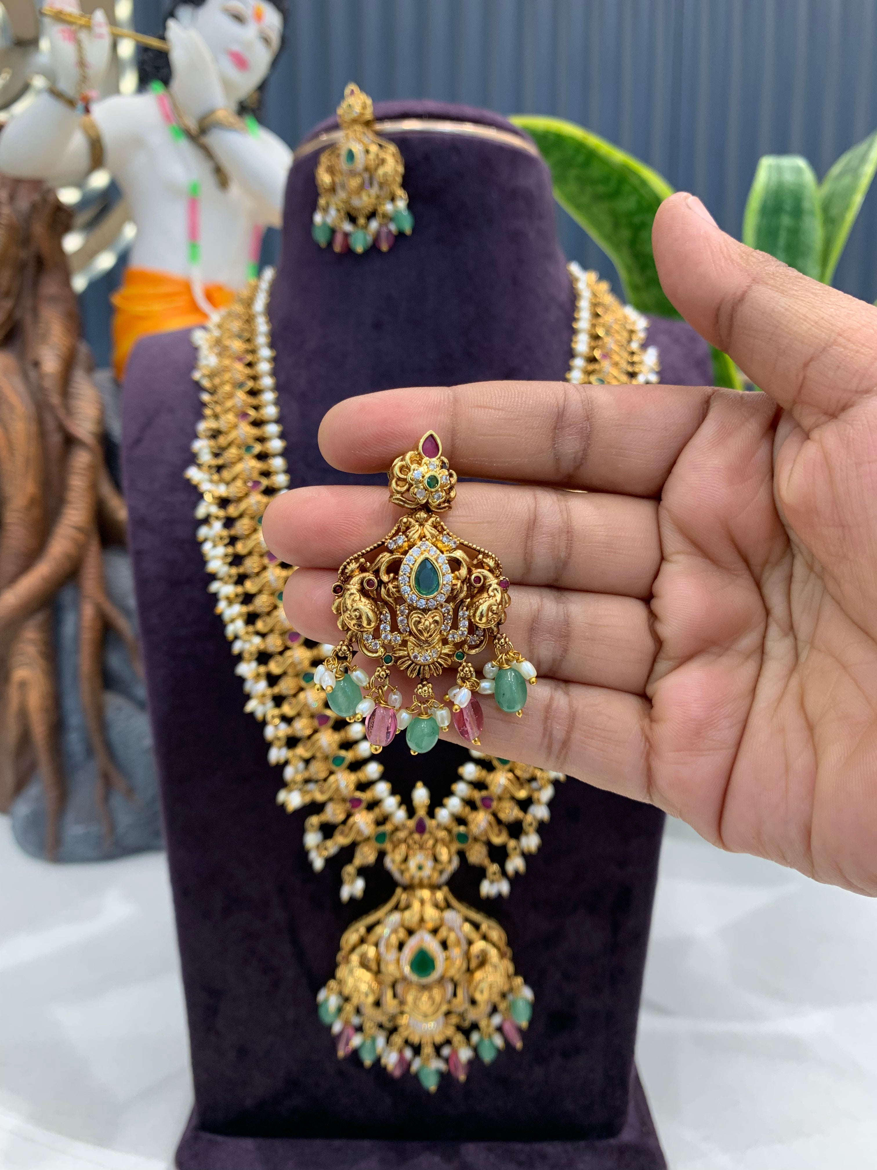 Beautiful multi color peacock design beads finishing long haram with screwback ear hangings