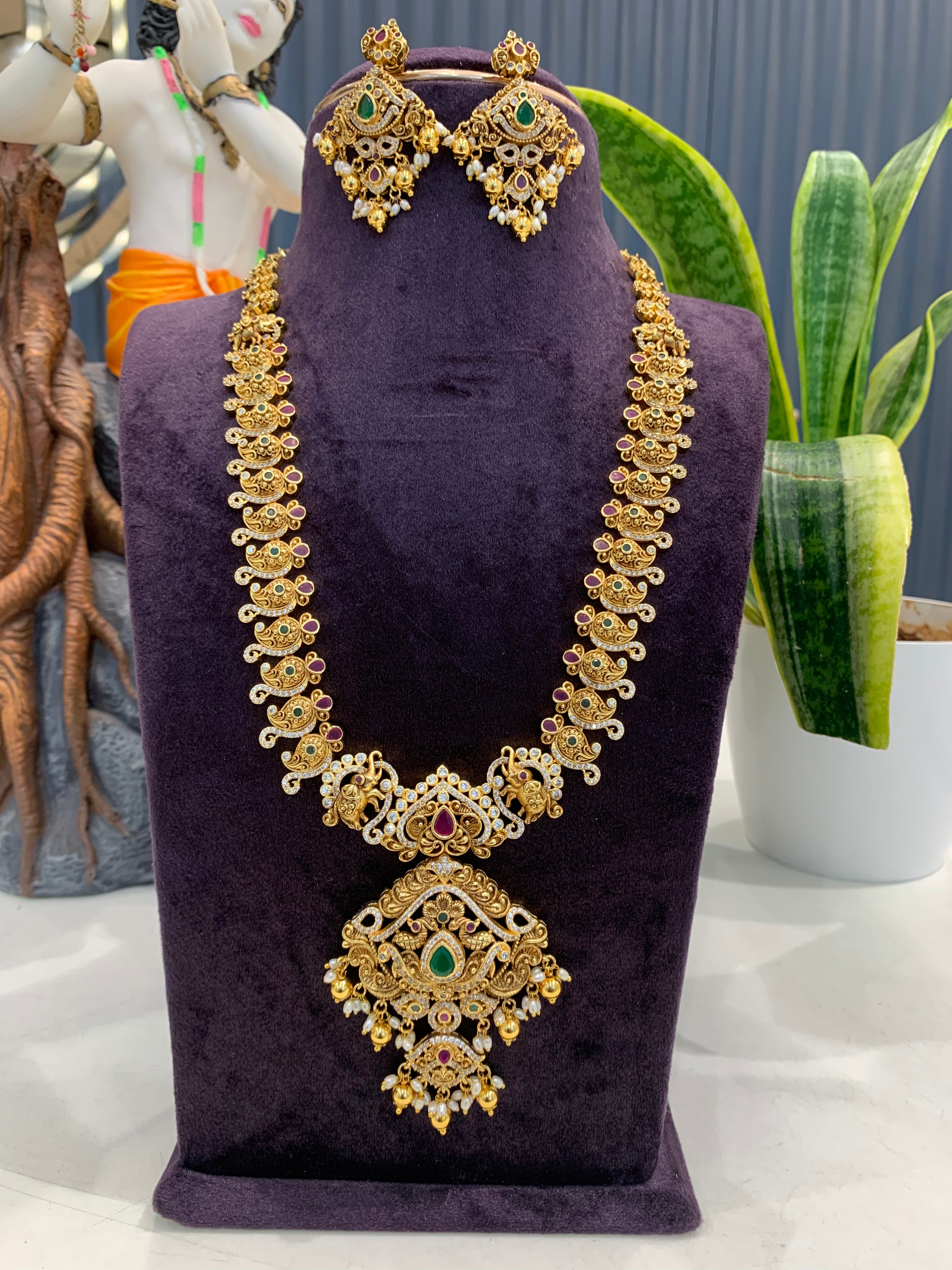 Beautiful CZ stones & peacock design long haram with screwback ear hangings