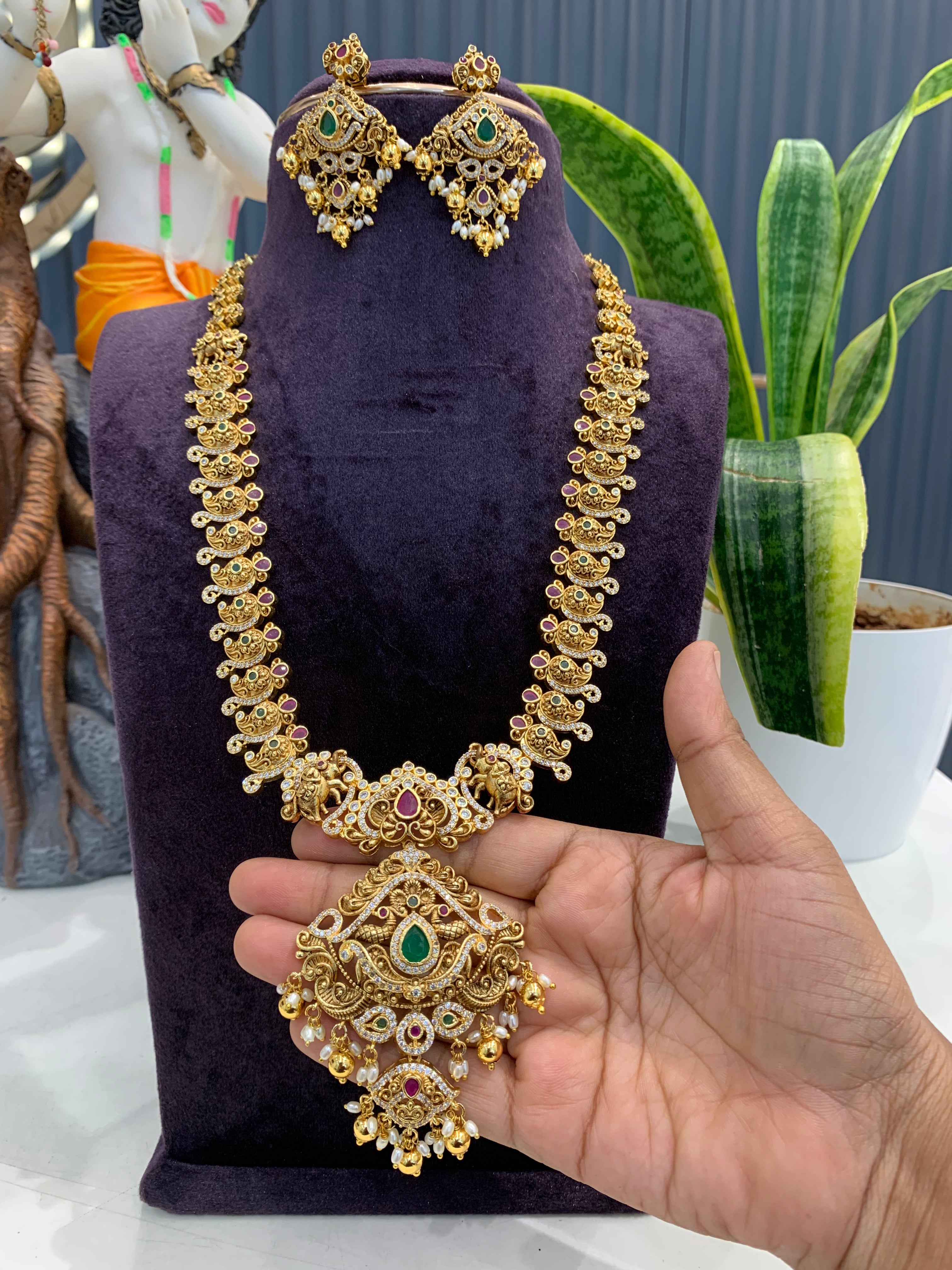 Beautiful CZ stones & peacock design long haram with screwback ear hangings