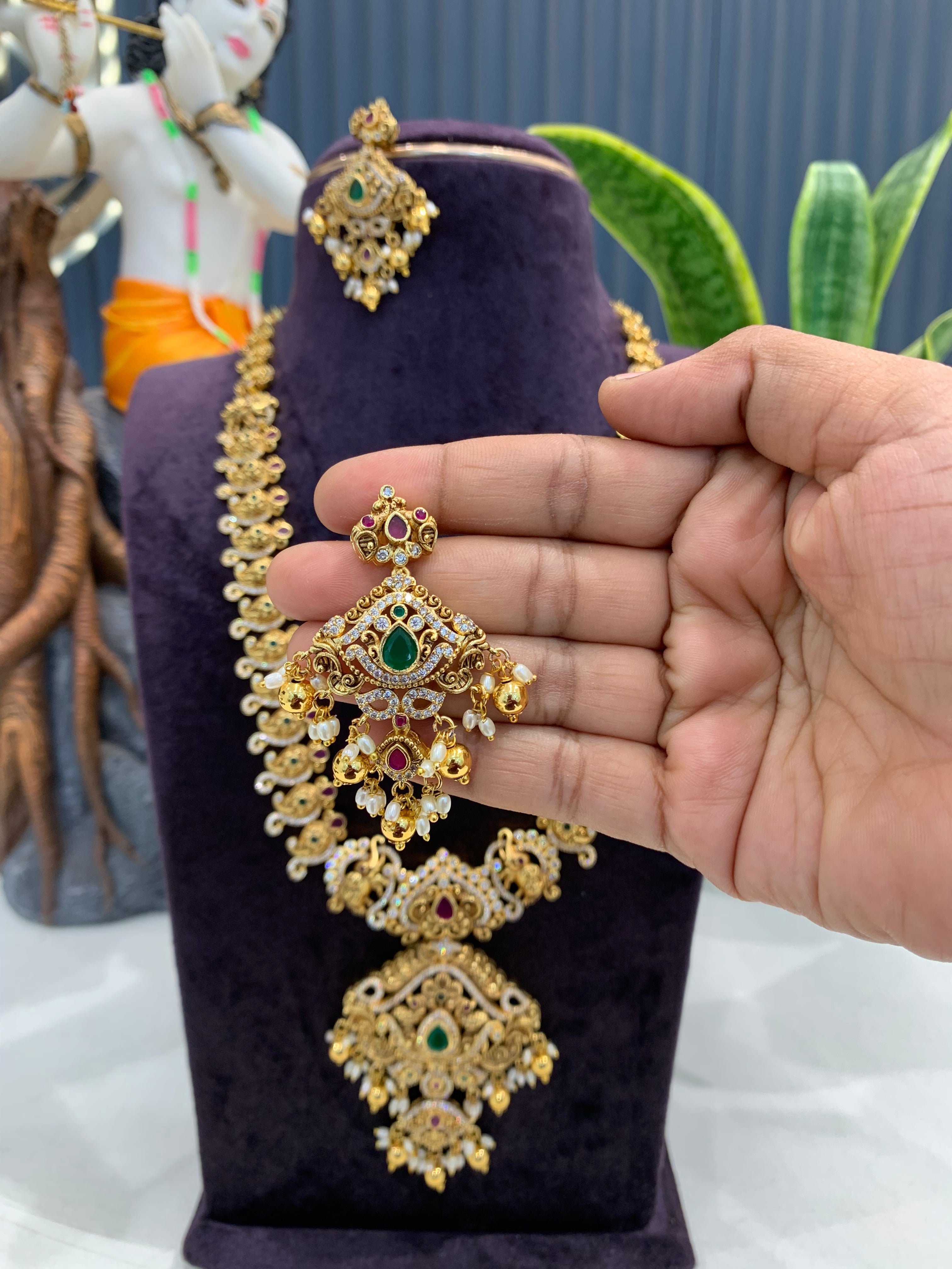 Beautiful CZ stones & peacock design long haram with screwback ear hangings