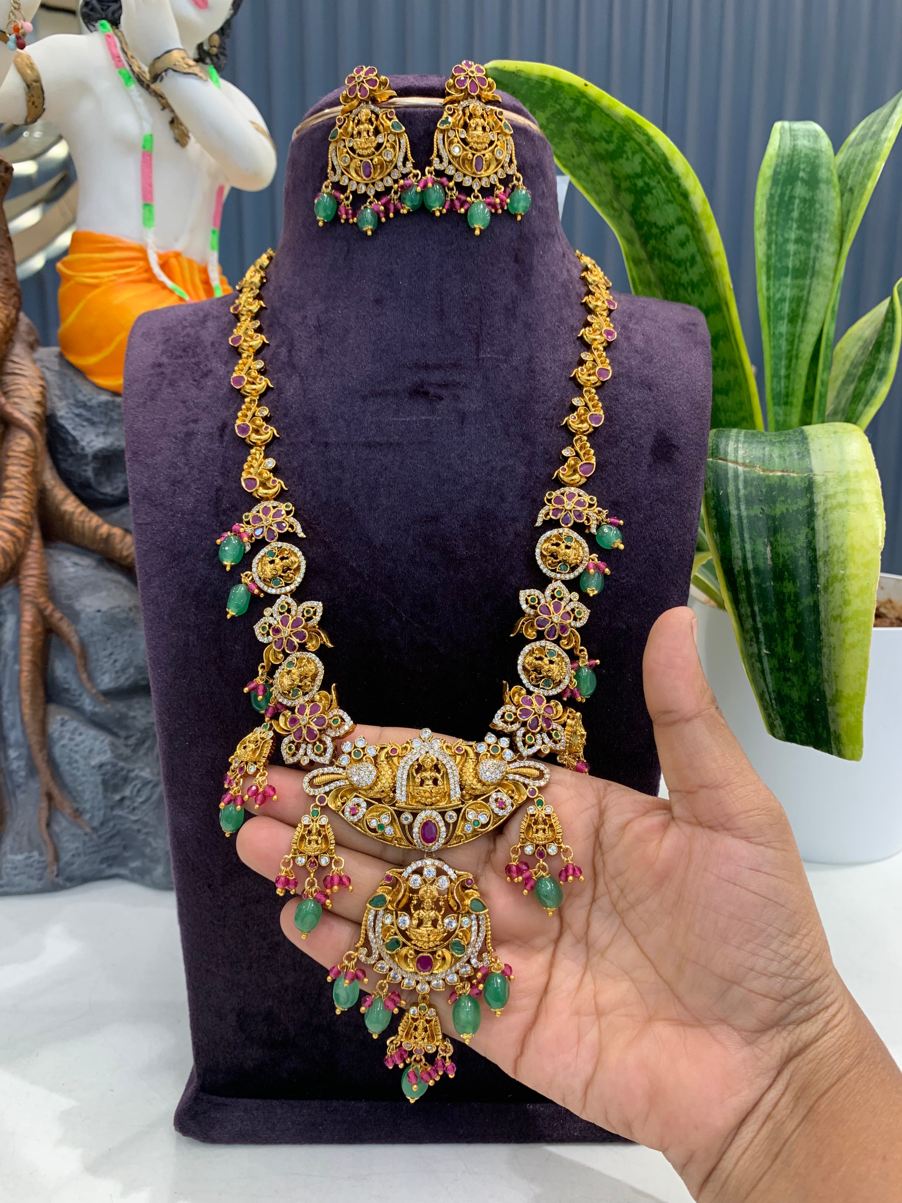 Beautiful Lakshmi devi & pota stone long haram with screwback ear hangings