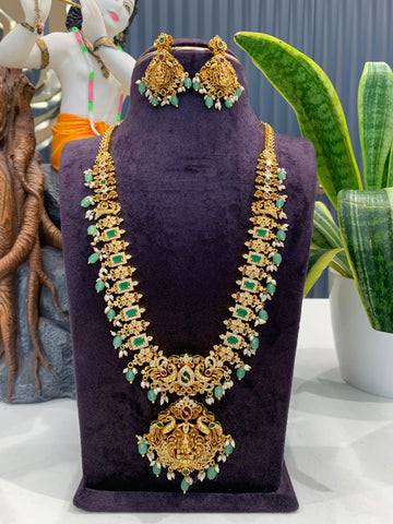 Beautiful embossing lakshmi devi & peacock design long haram with screwback ear hangings