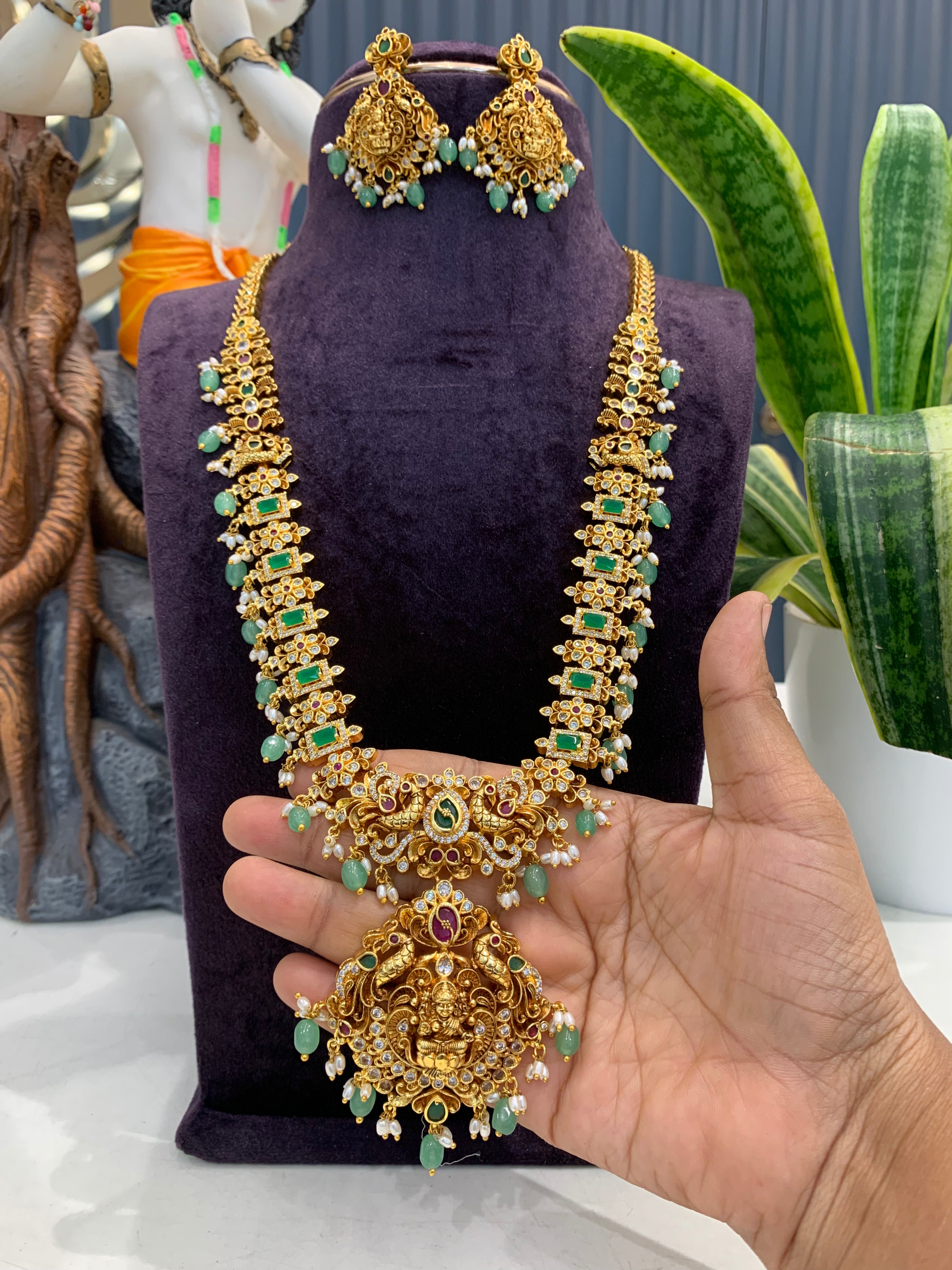 Beautiful embossing lakshmi devi & peacock design long haram with screwback ear hangings