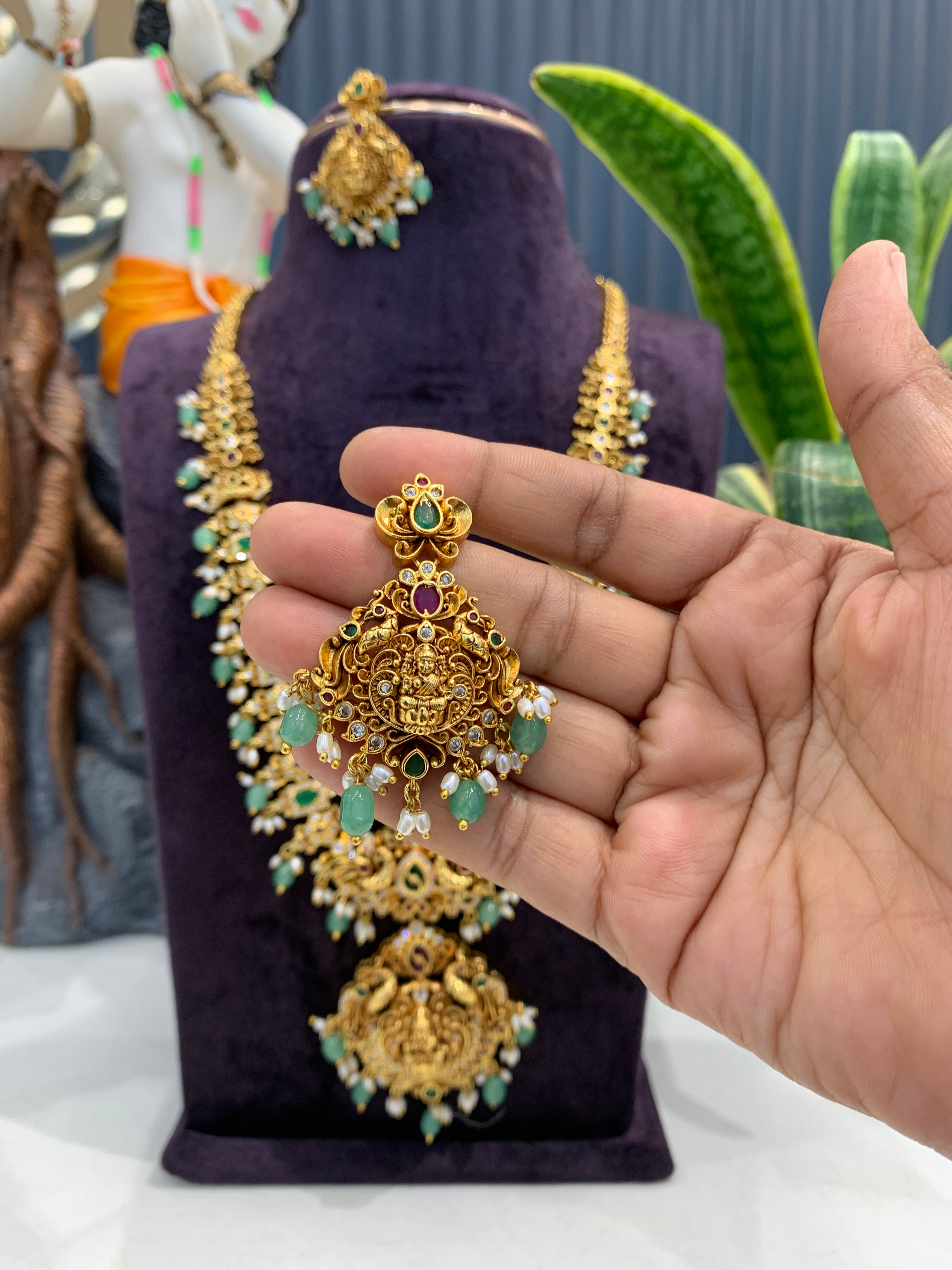 Beautiful embossing lakshmi devi & peacock design long haram with screwback ear hangings