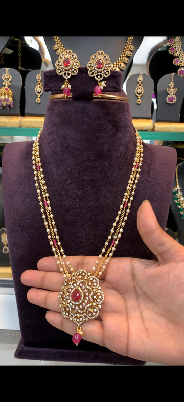 Beautiful ruby stone pendant with handmaking chandraharam & pearls mala 18 inchs long