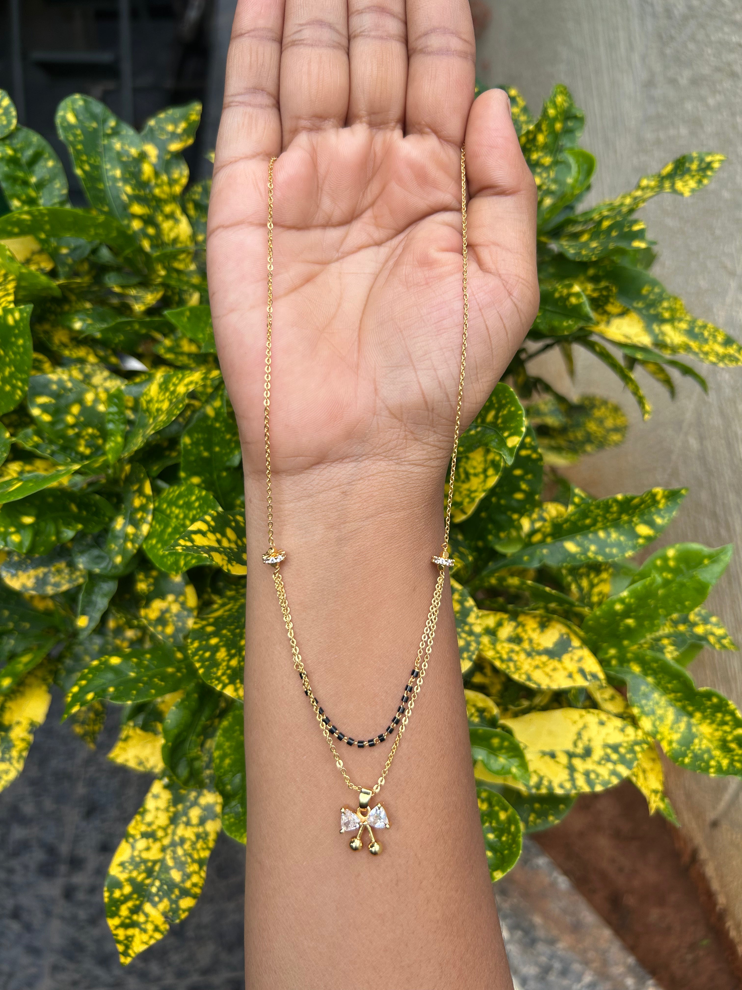 Beautiful simple white stone locket with blackbeads & chandraharam chain 18 inchs long