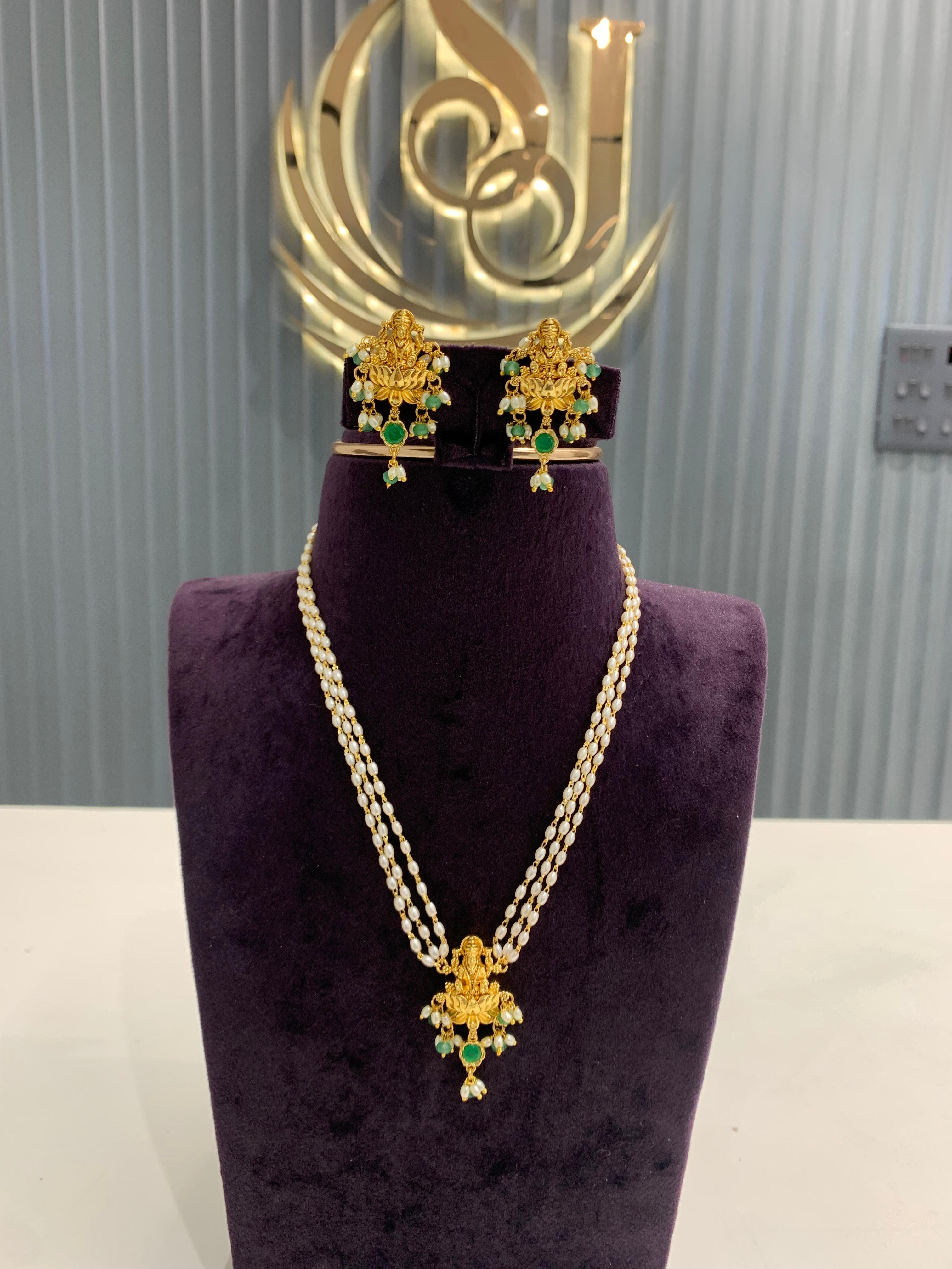 Beautiful pearls mala Lakshmi pendant set with pushback earrings