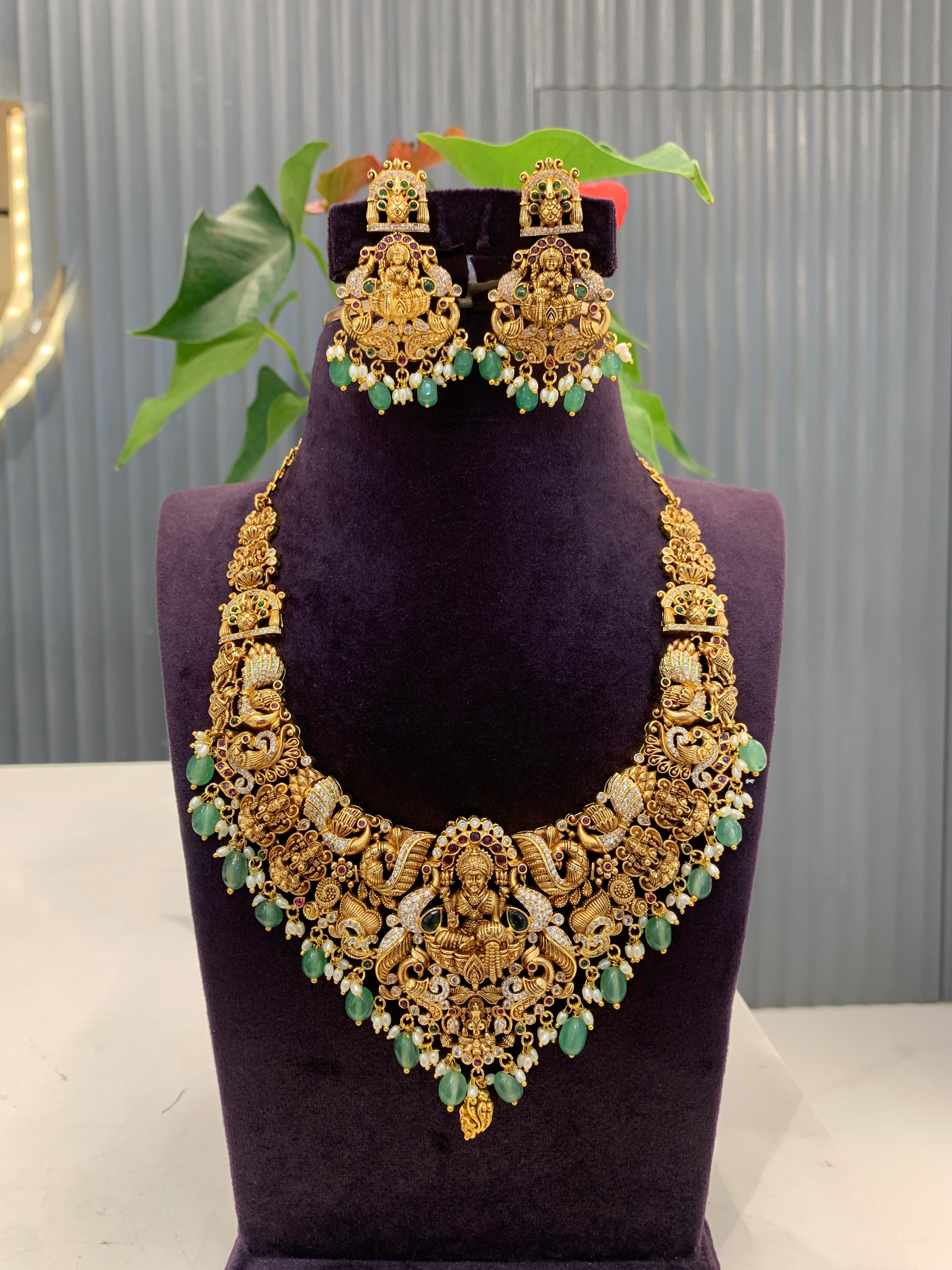 Beautiful Lakshmi devi mini haram with green beads and pushback earrings