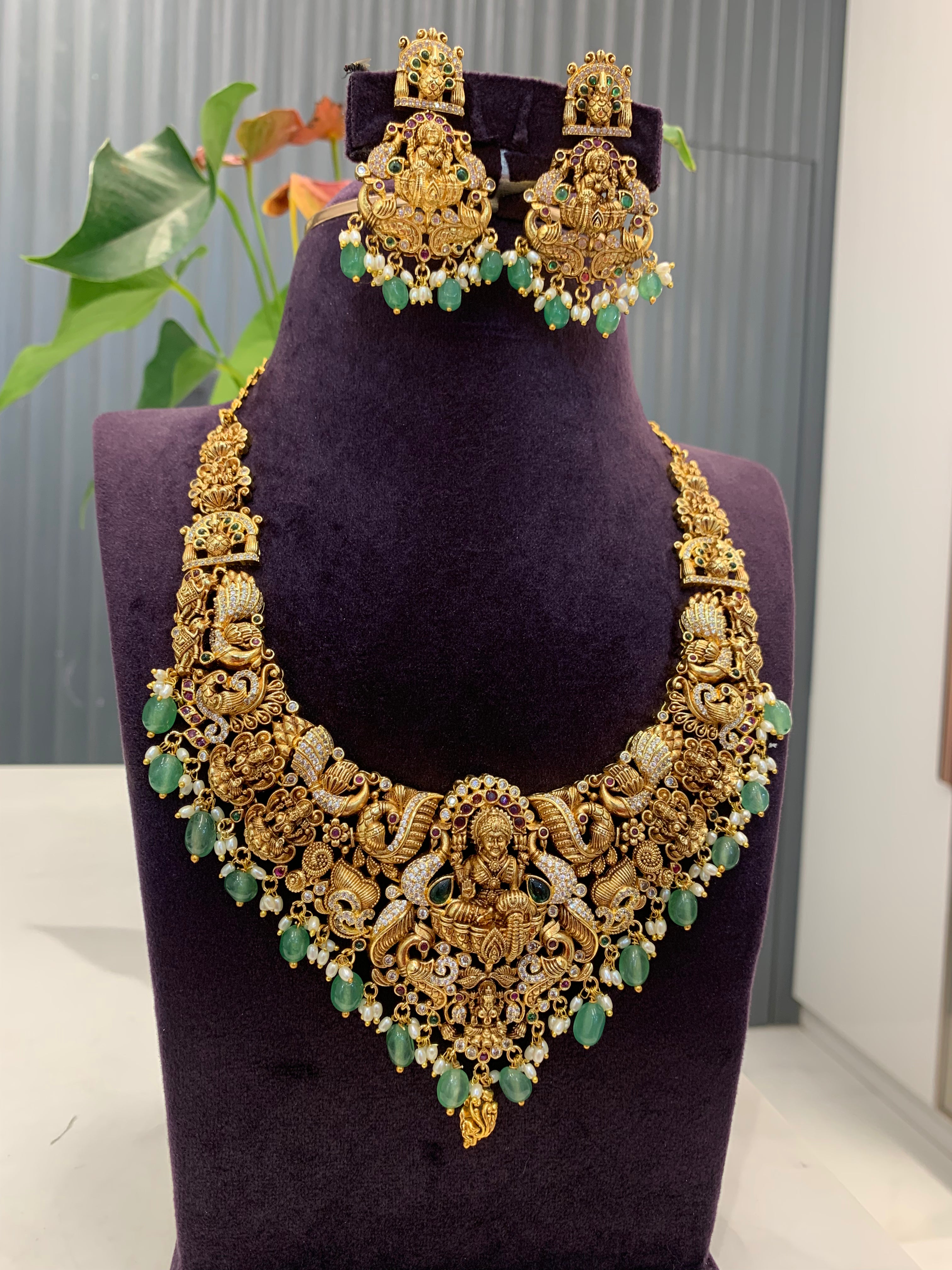 Beautiful Lakshmi devi mini haram with green beads and pushback earrings
