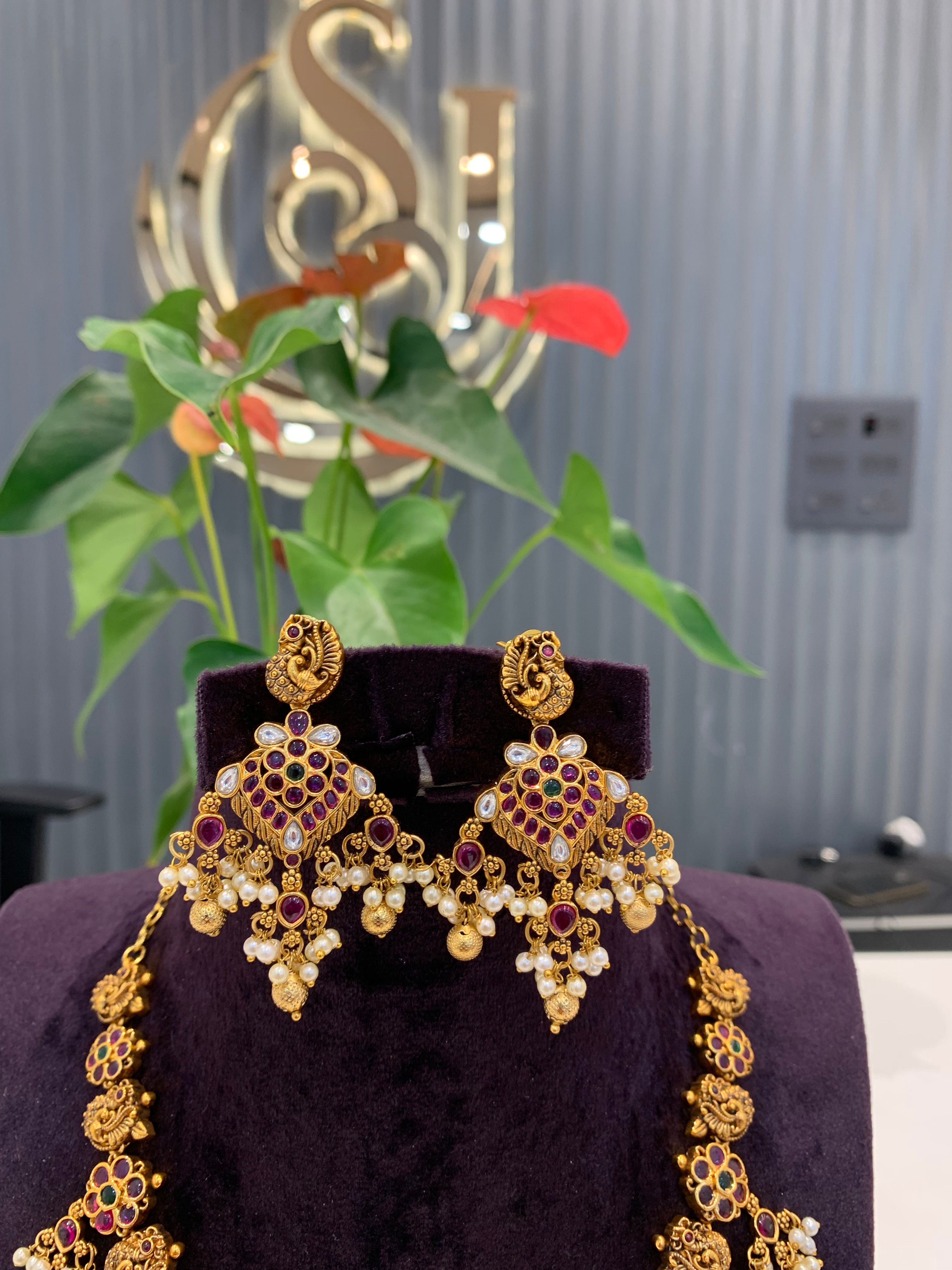 Beautiful peacock design necklace Jadav stone  with pearls and gold balls