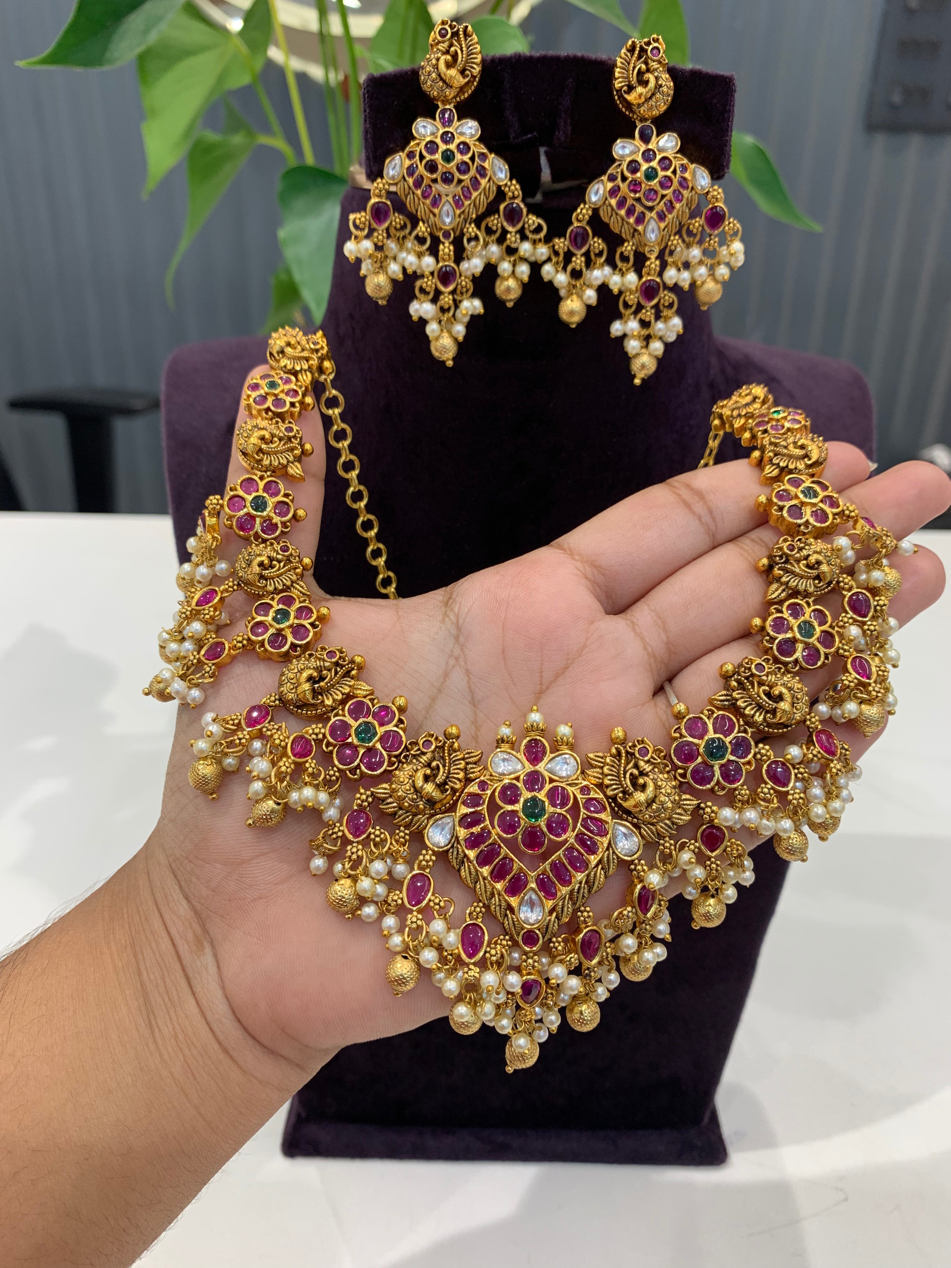 Beautiful peacock design necklace Jadav stone  with pearls and gold balls