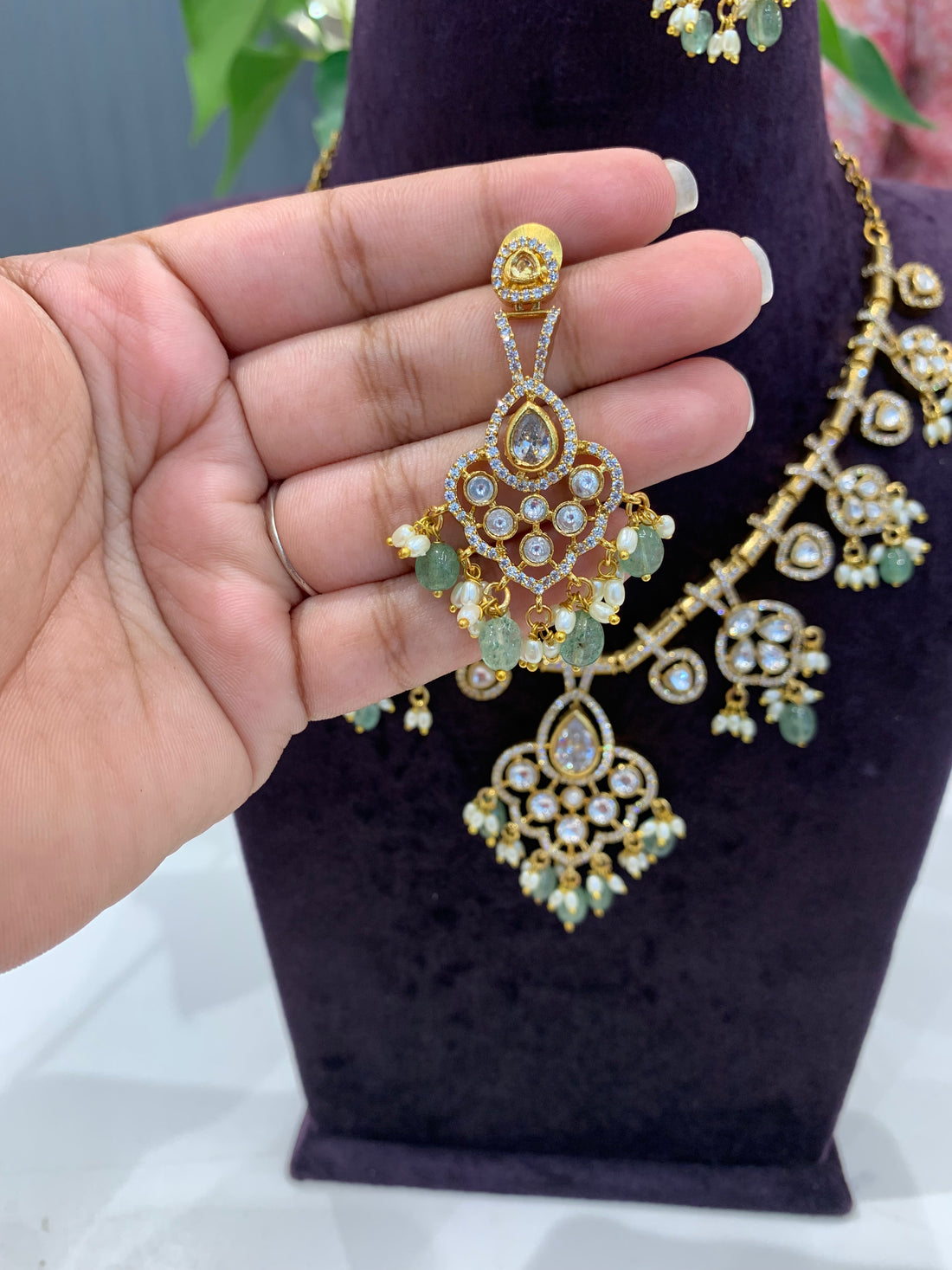 Beautiful locket model necklace and earrings with Aqua beads